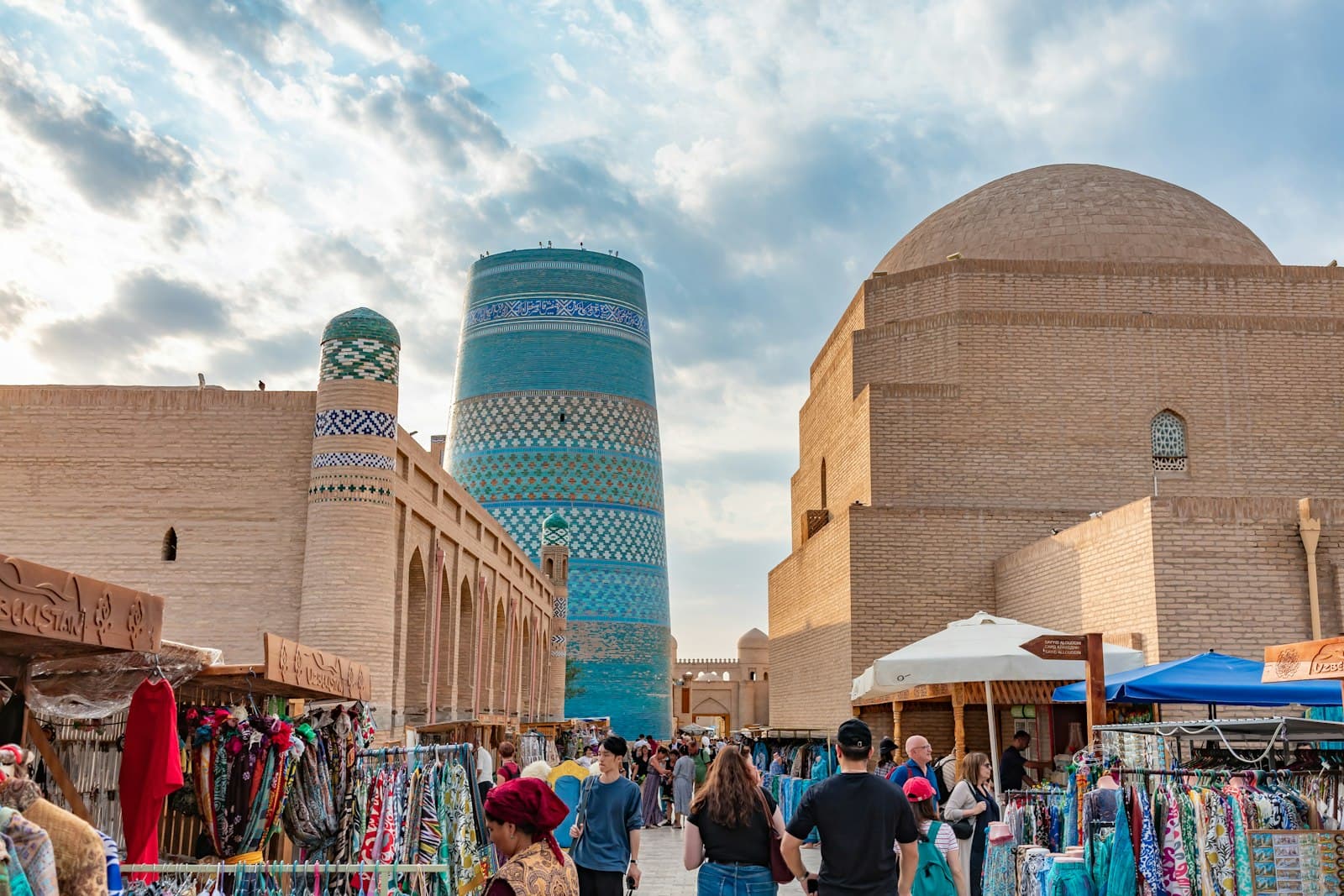 Shahrisabz — A group of people walking around a market