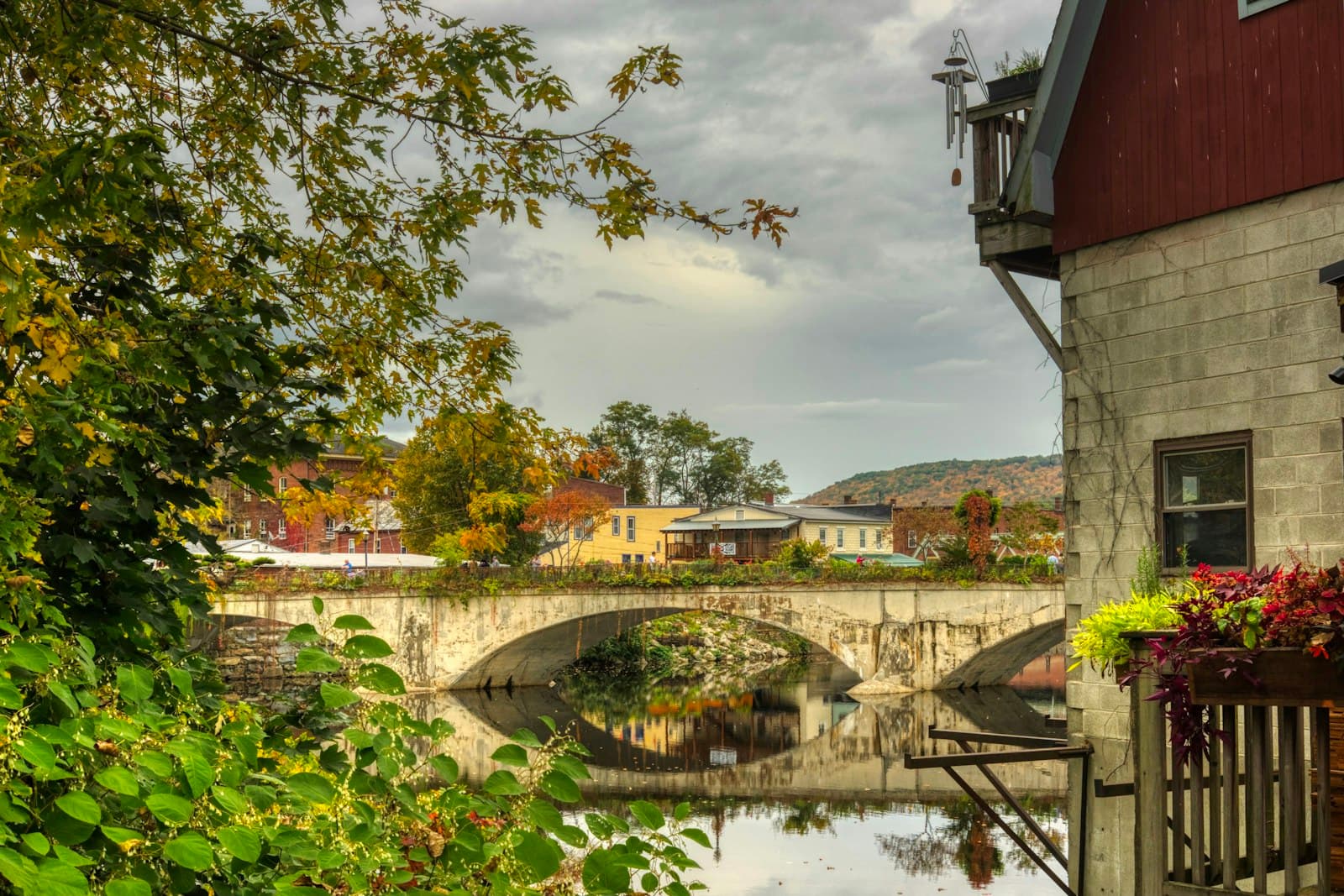 Shelburne — a bridge over a body of water next to a building