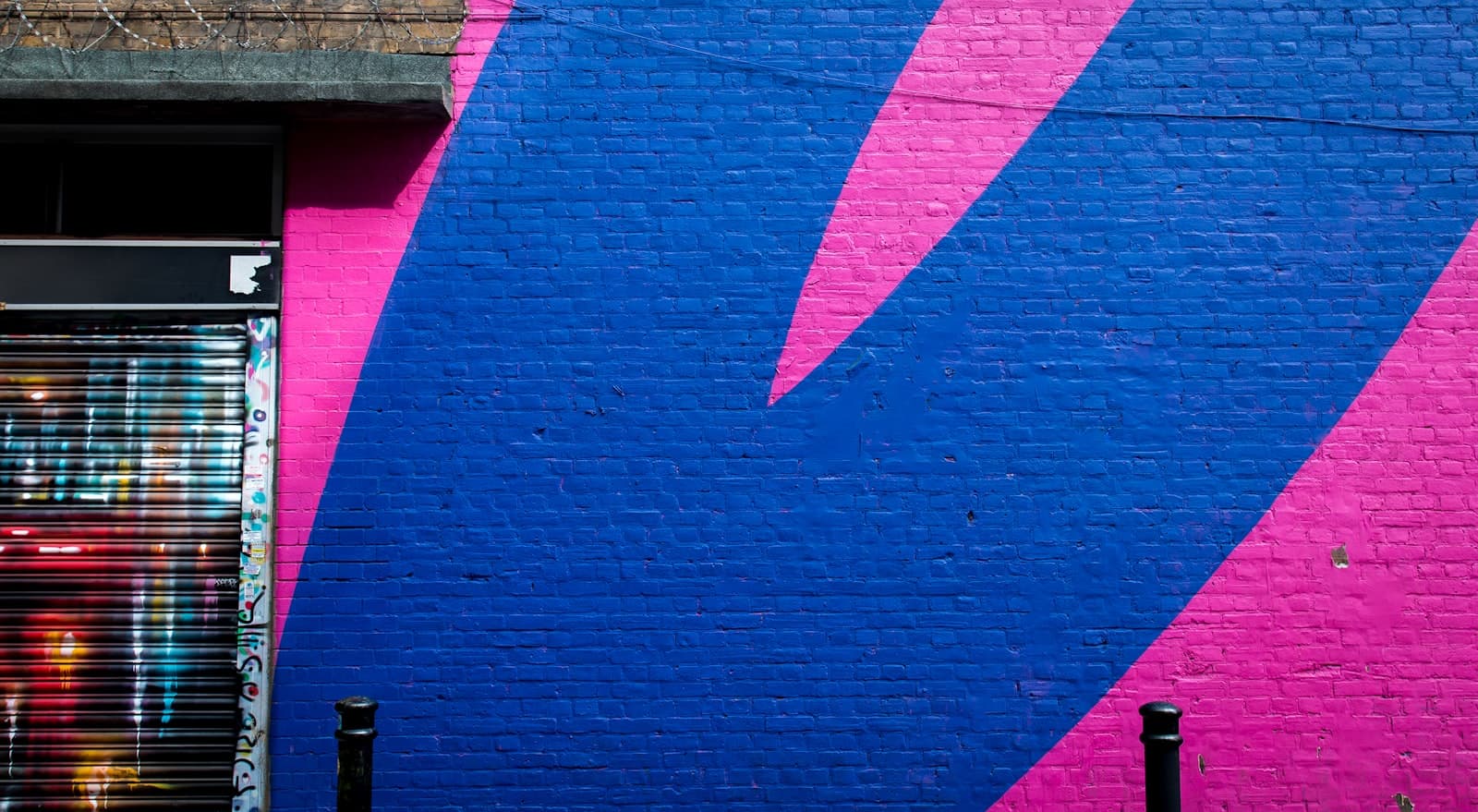 Shoreditch Street Art — blue and pink commercial store wall