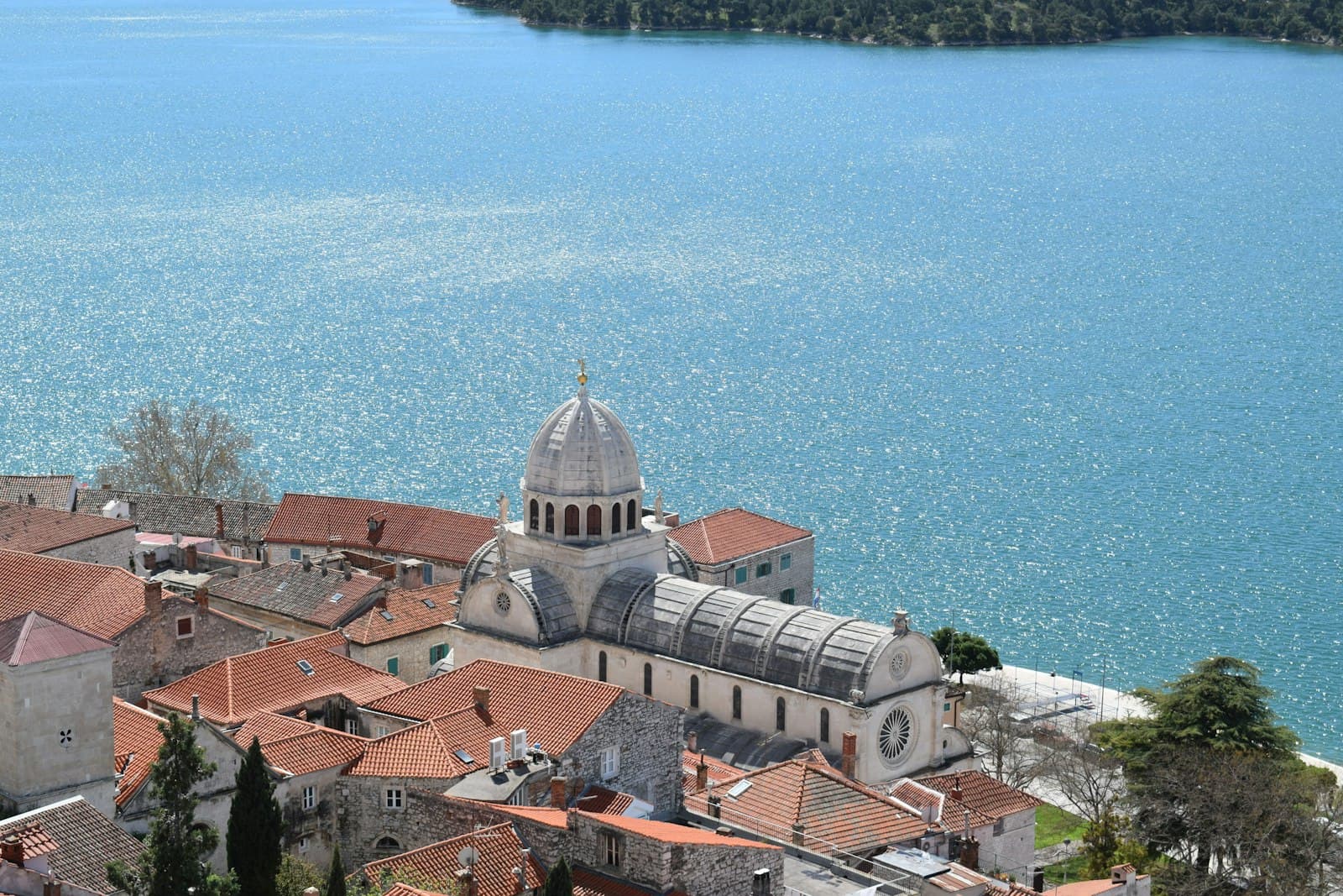 Šibenik — an aerial view of a city with a lake in the background