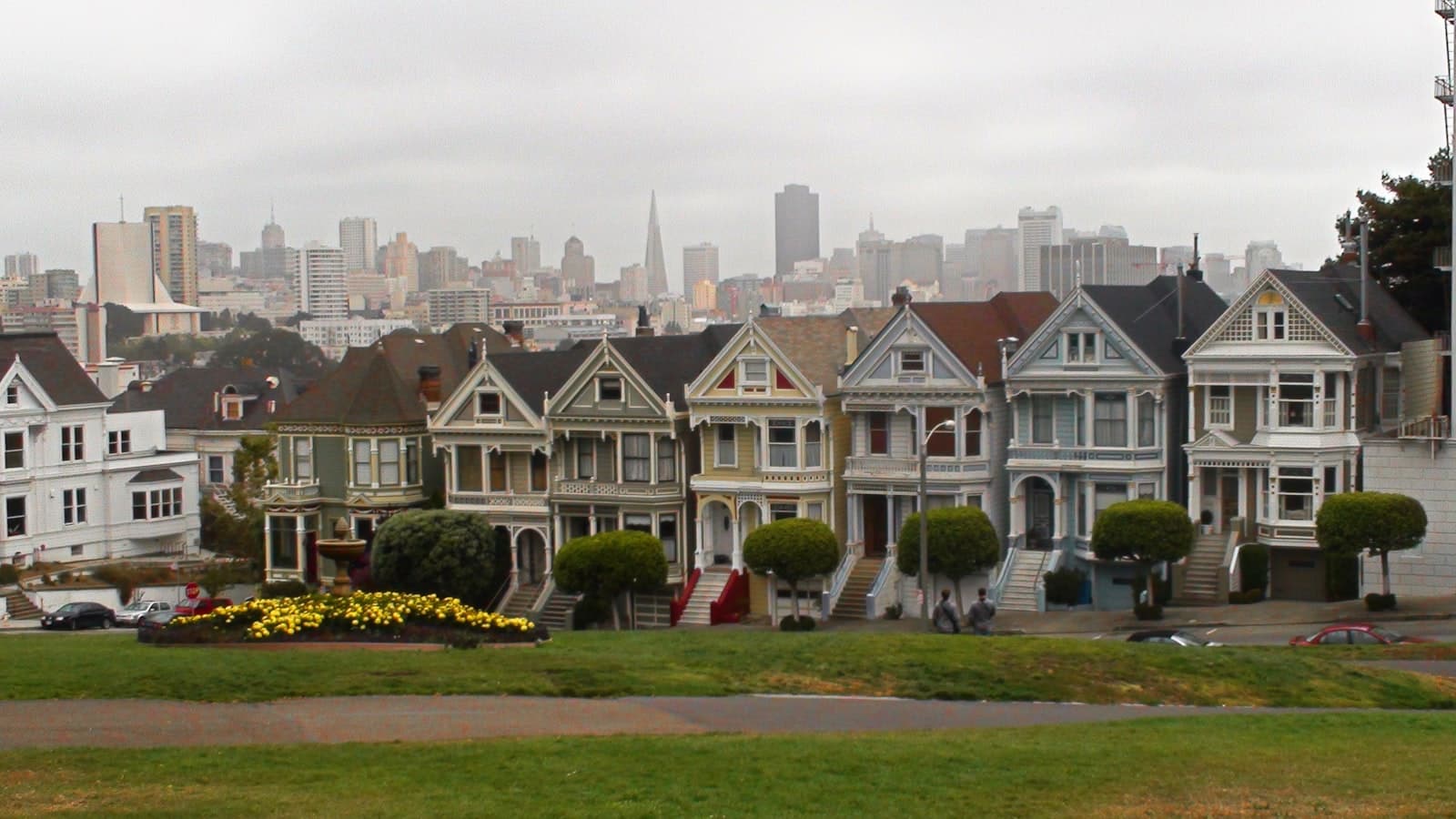 Sisters — A row of houses with a city in the background
