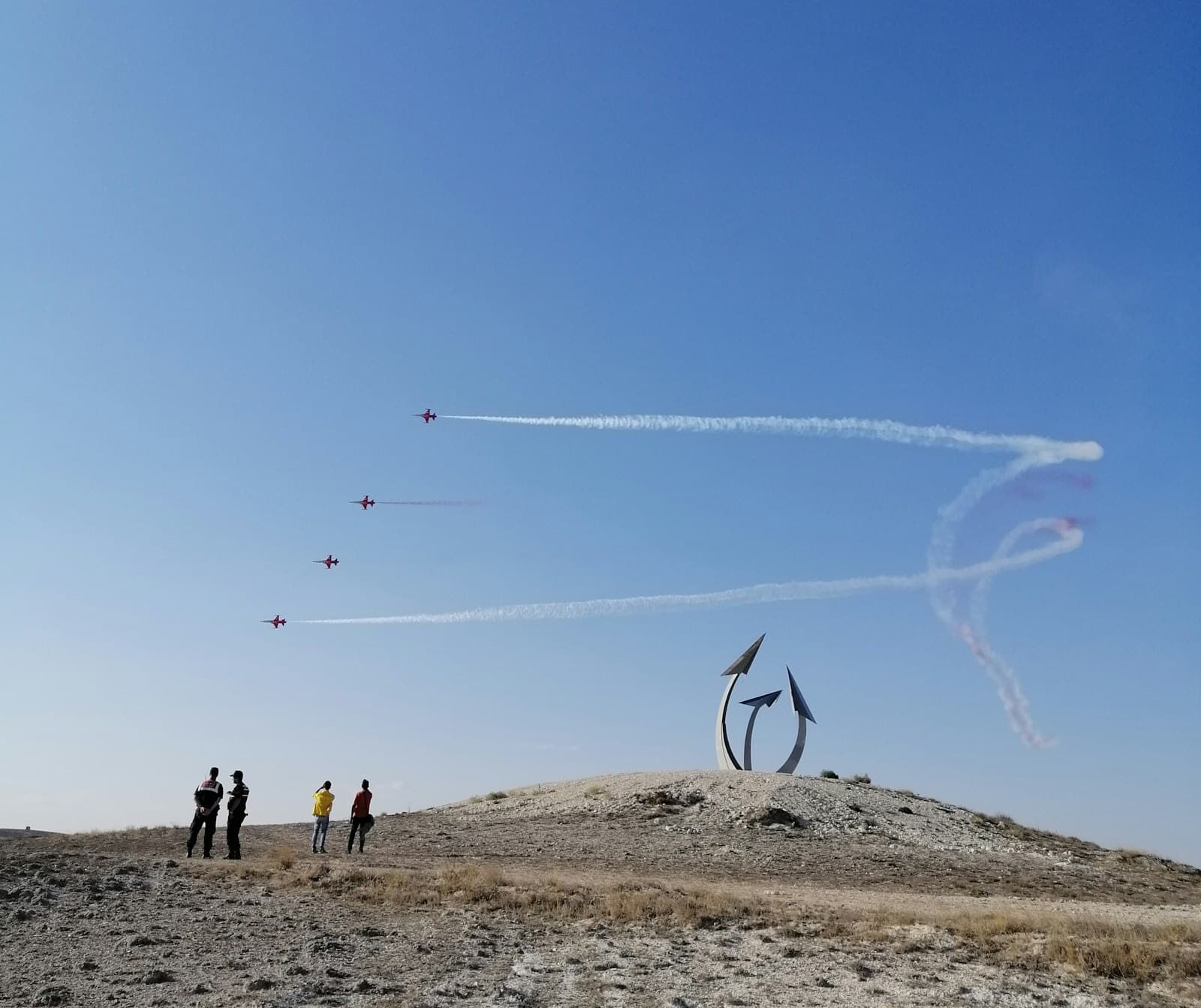 Sivrihisar — people standing on brown sand under blue sky during daytime