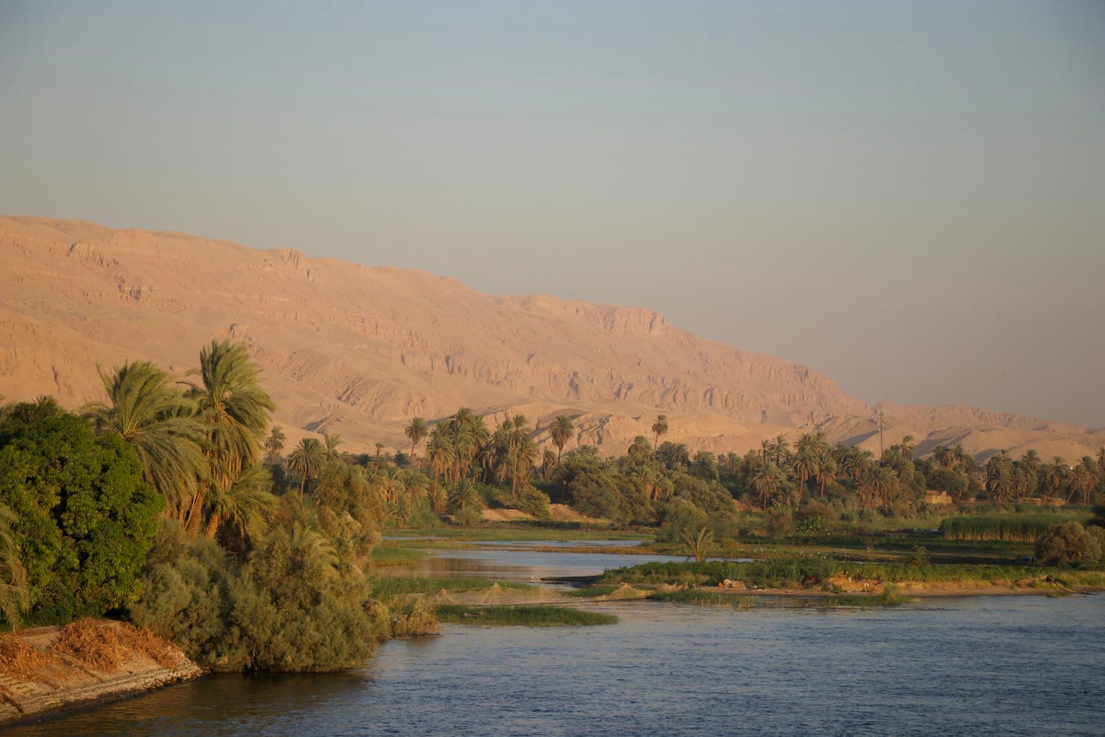 Siwa — a body of water surrounded by palm trees