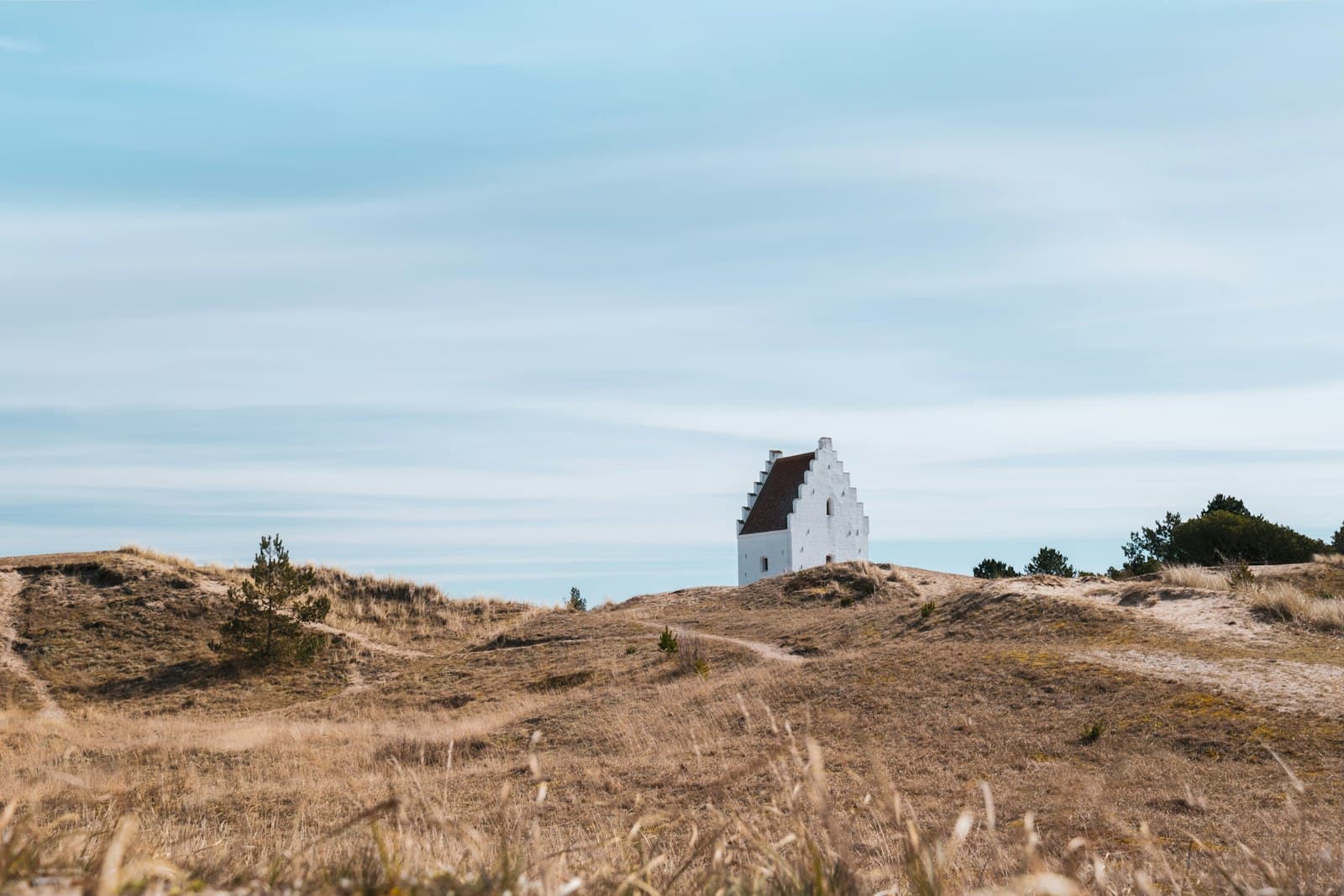 Skagen — a white house sitting on top of a hill