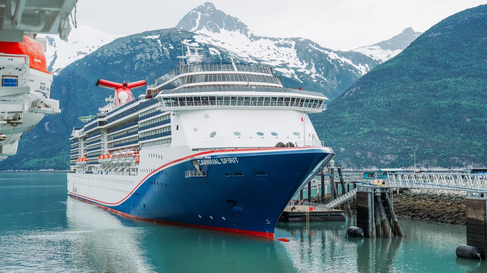 Skagway — A cruise ship in a harbor with mountains in the background