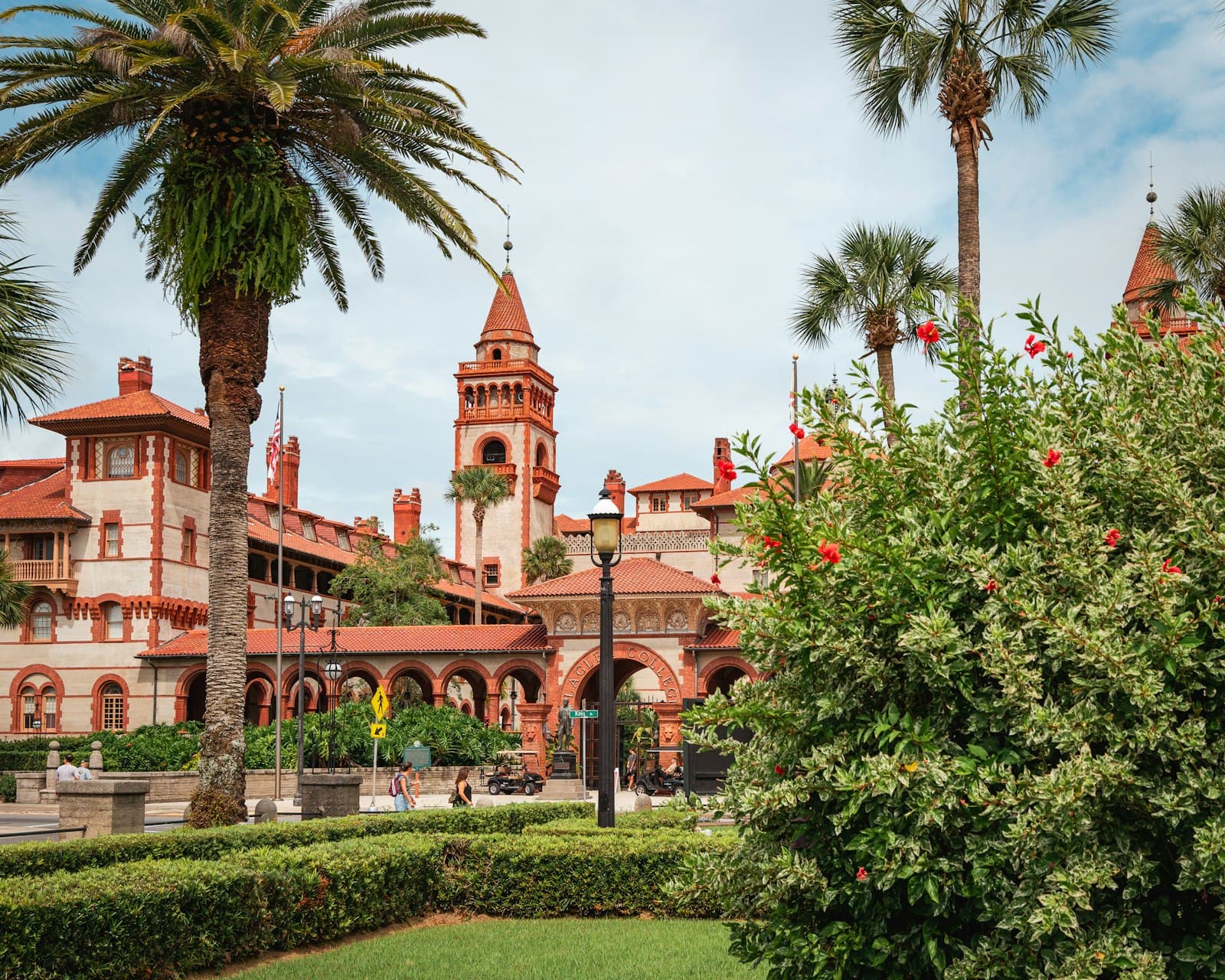 St. Augustine — A large building with a clock tower next to a lush green park