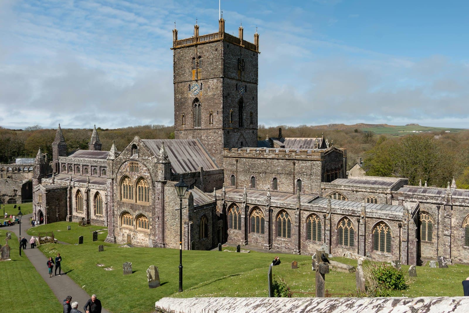 St Davids — a large building with a tall tower next to a lush green field
