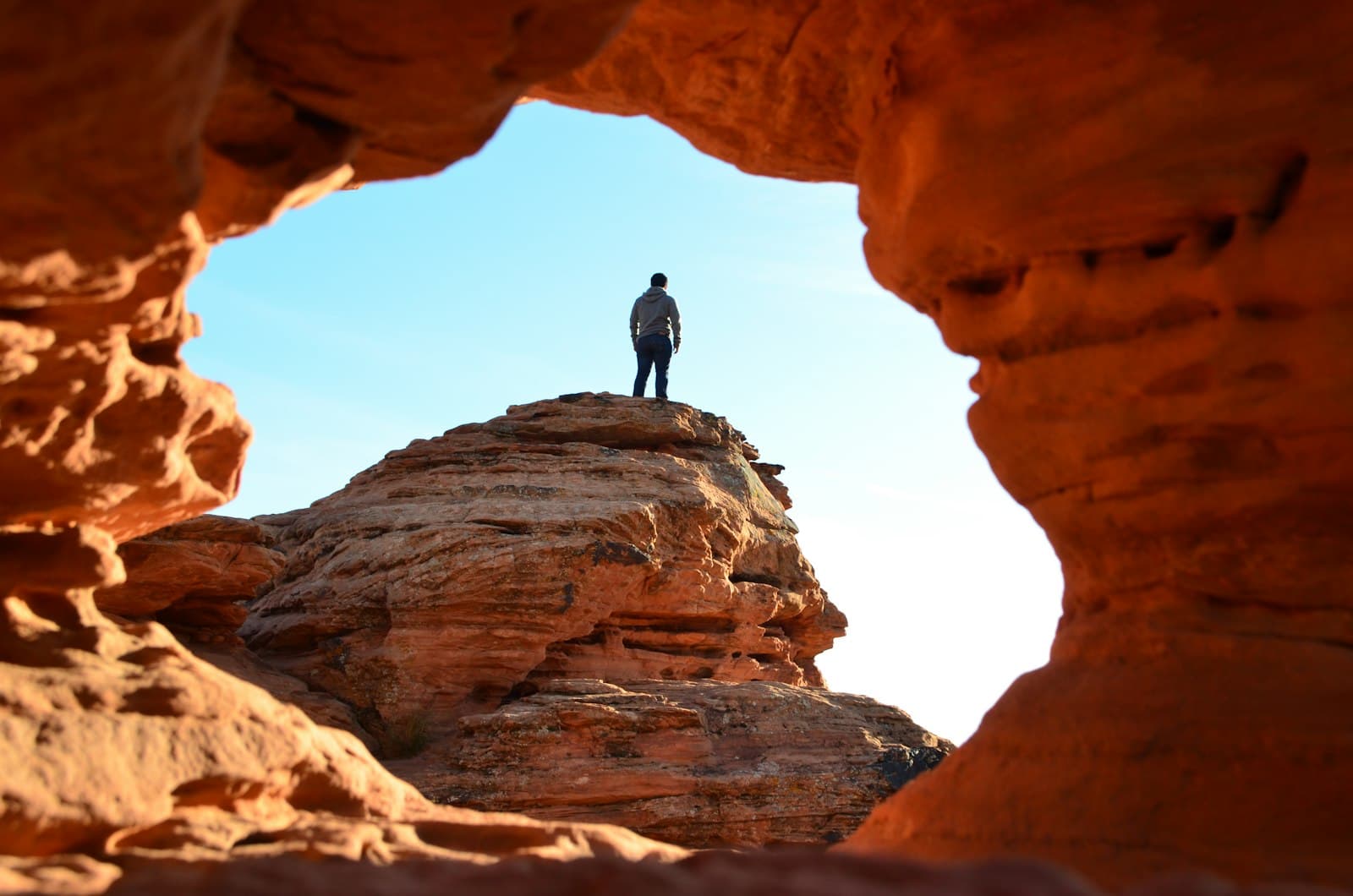 St. George — man standing on brown rock formation