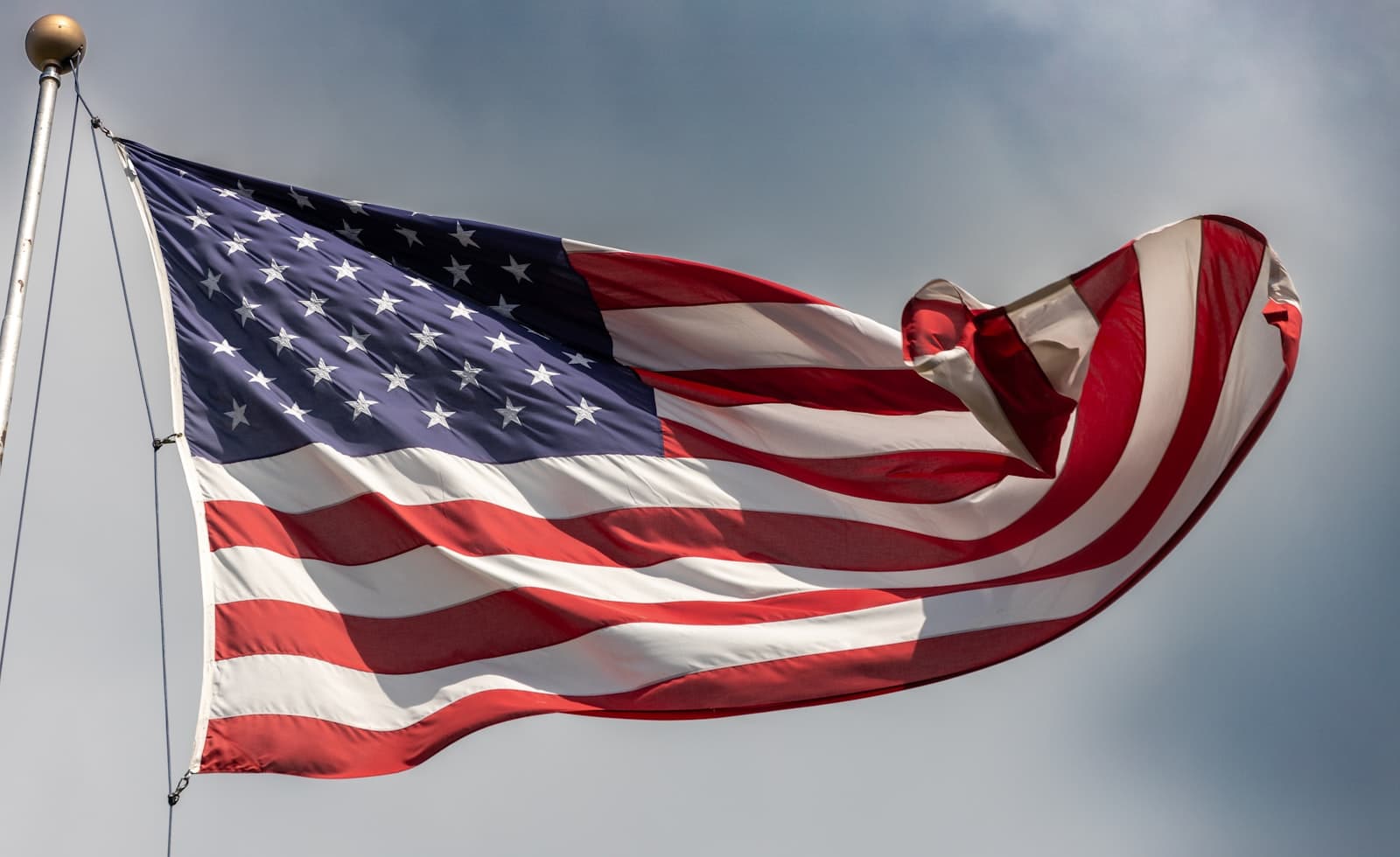 State College — a large american flag flying in the wind