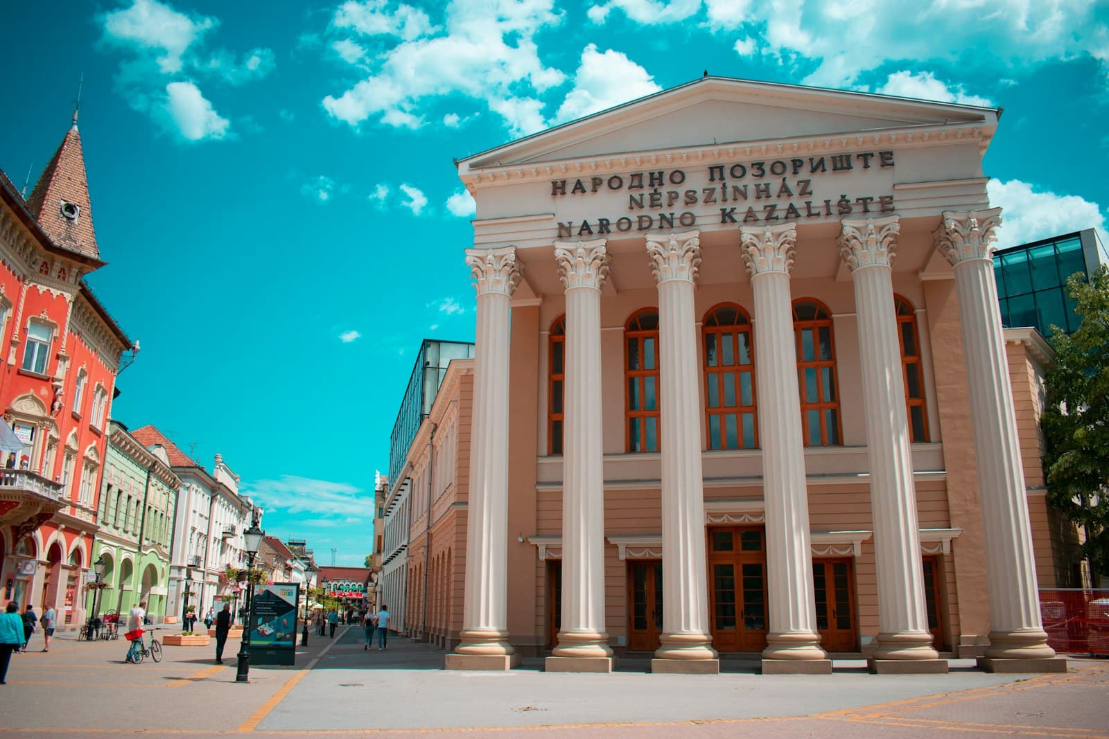 Subotica — people walking near white concrete building during daytime