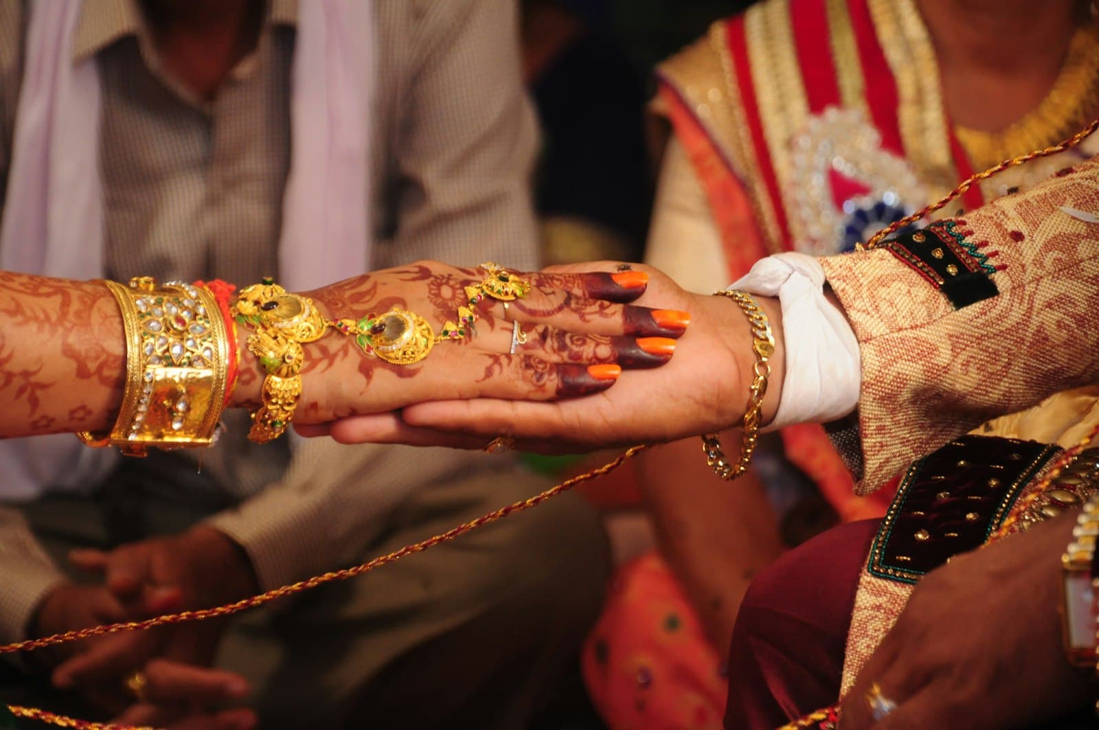 Surat — man in white dress shirt holding gold and red crown