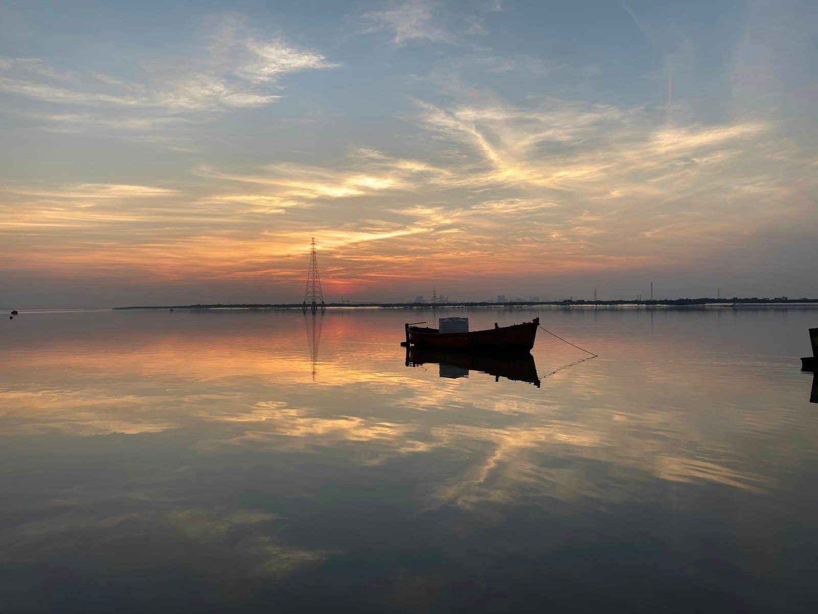 Surat — boat on calm sea during sunset