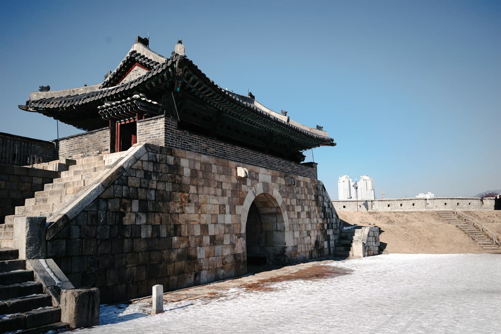 Suwon — a stone building with stairs leading up to it