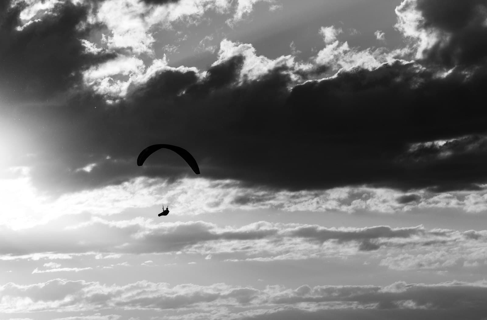 Sviyazhsk — a person para sailing in the ocean under a cloudy sky