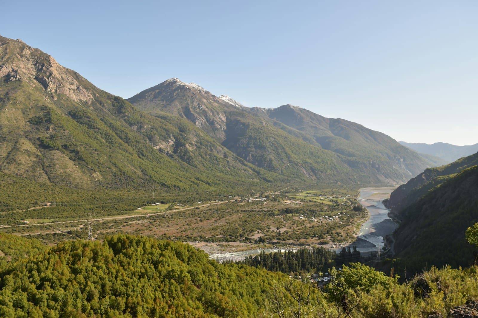 Talca — a river running through a valley between mountains