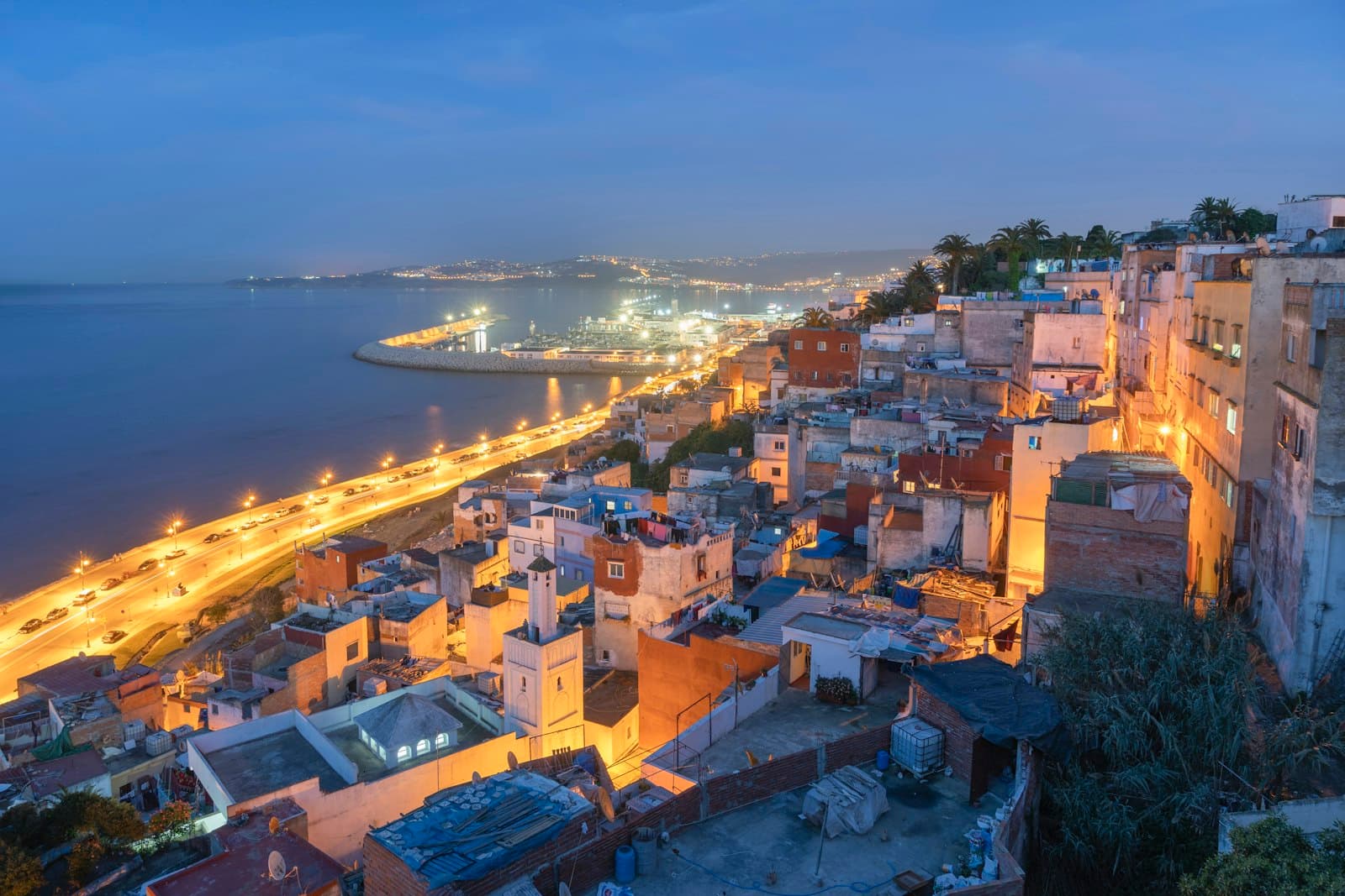 Tanger — aerial view of city near body of water during night time