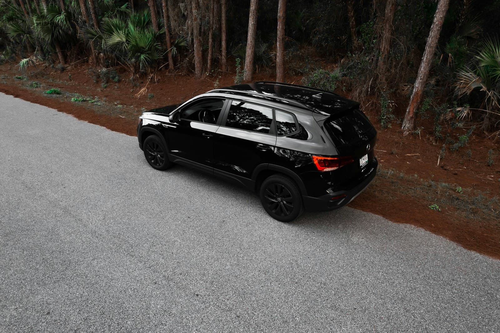 Taos — a black car parked on the side of a road