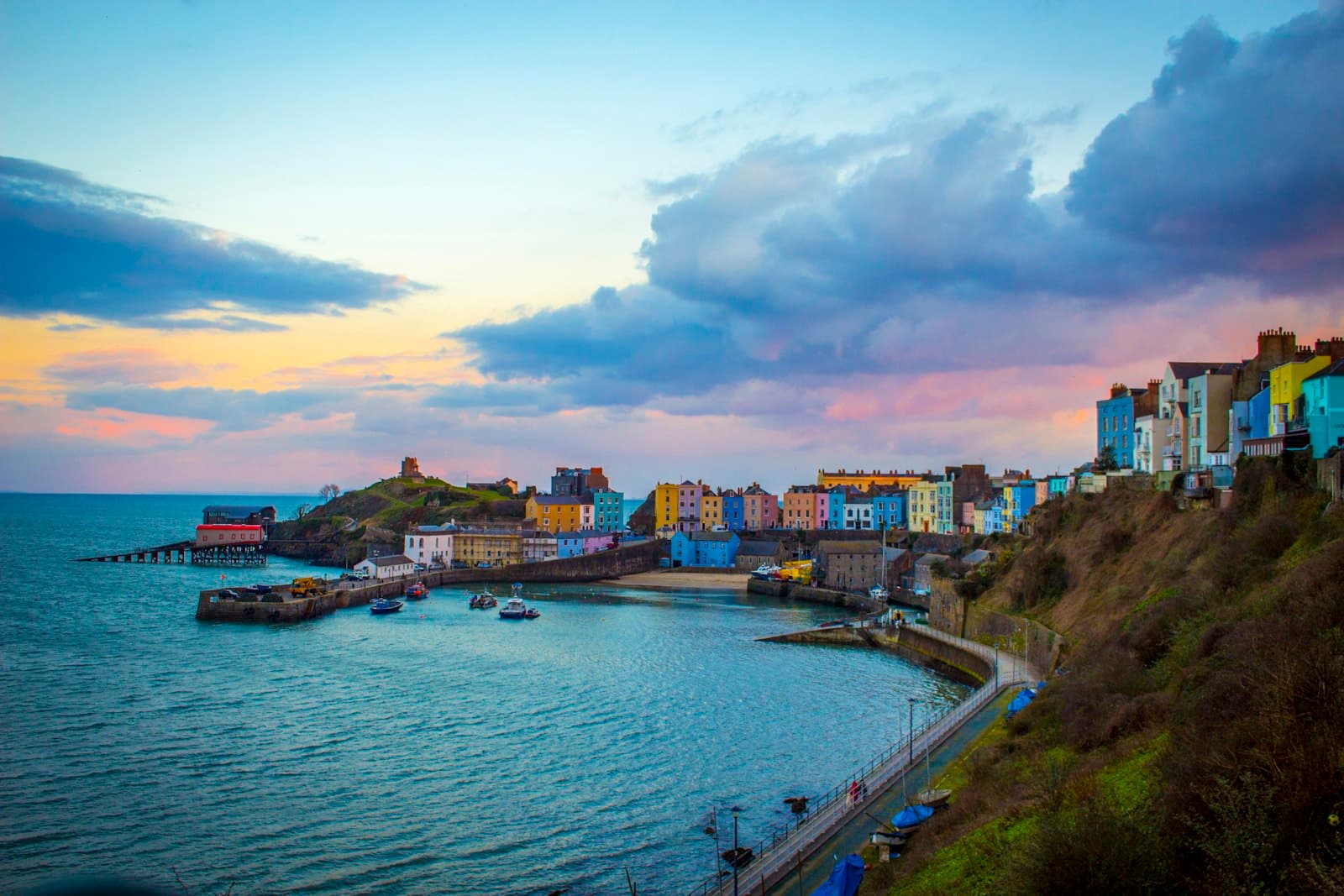 Tenby — multicolored buildings near cove under cloudy sky