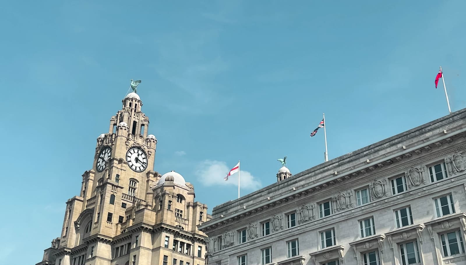 The Beatles in Liverpool — a tall building with a clock on the top of it