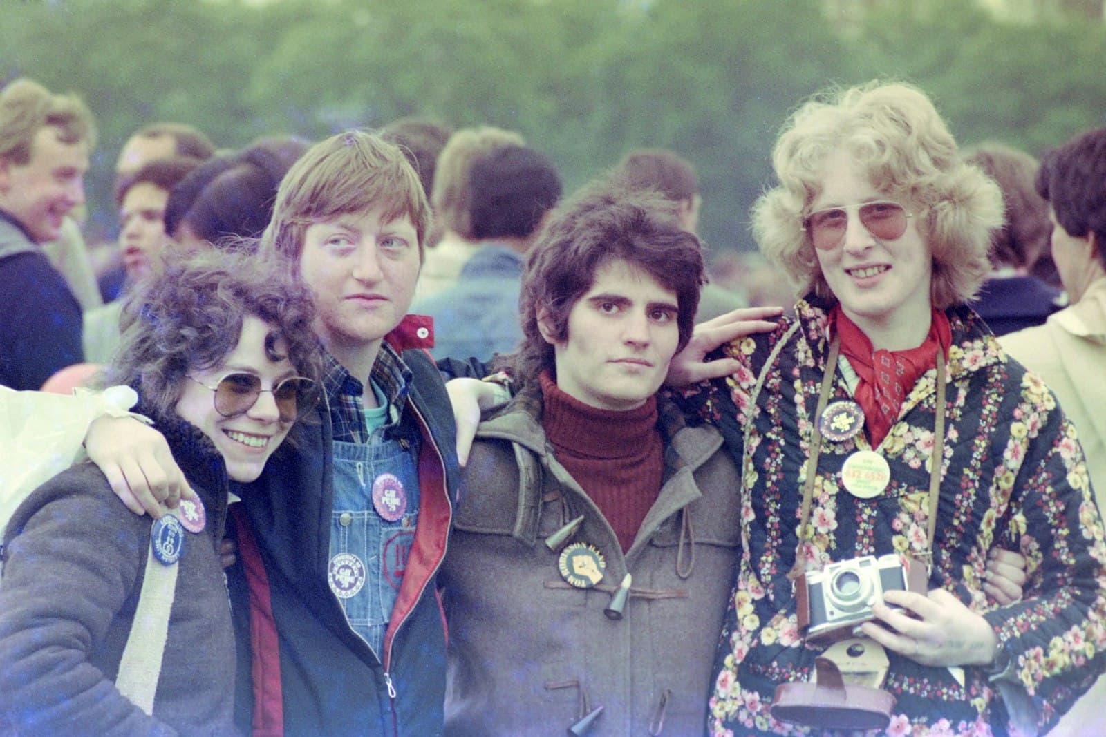 The Beatles in London — woman in blue denim jacket standing beside girl in red jacket
