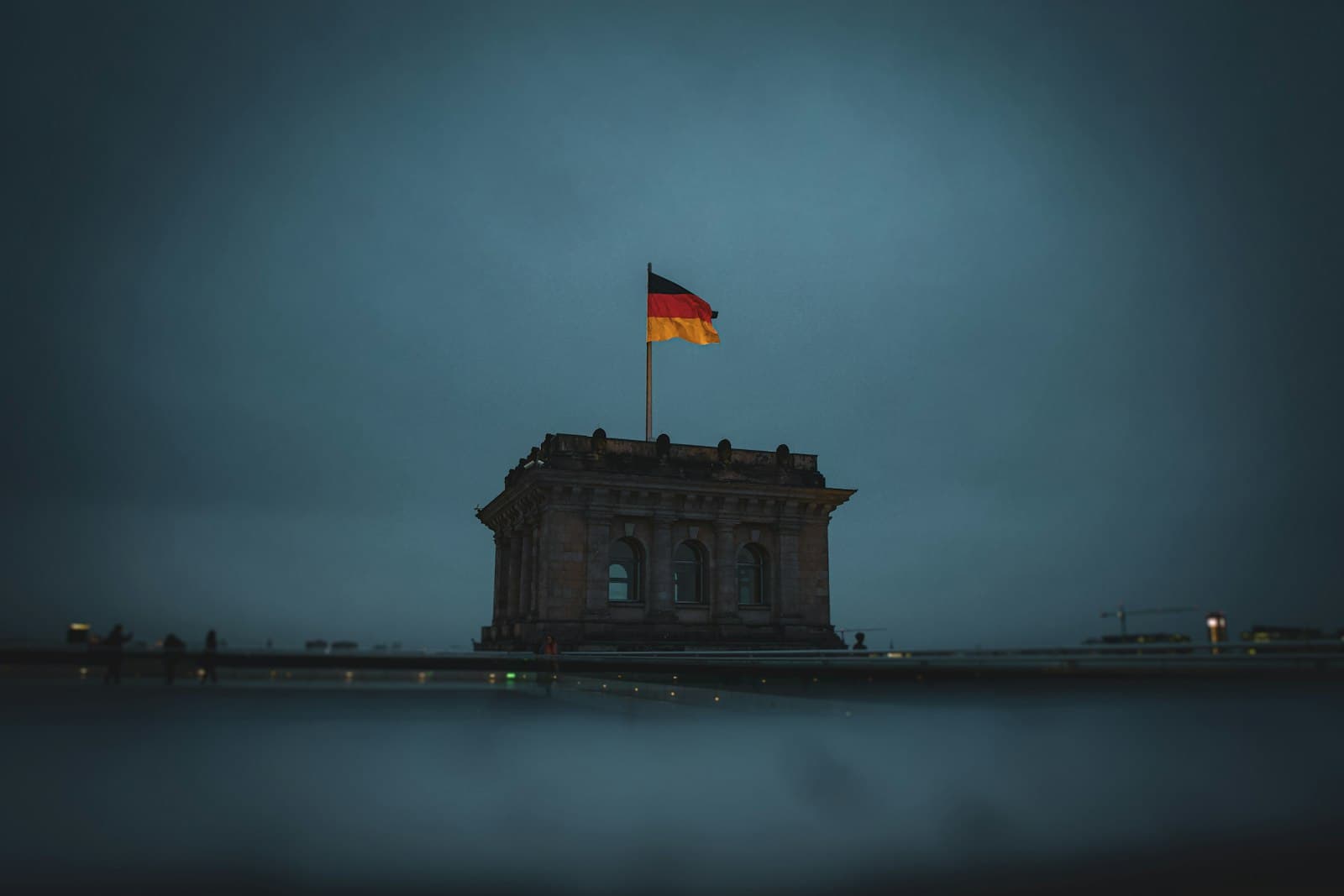 The Berlin Wall & the Cold War — flag of us a on top of building