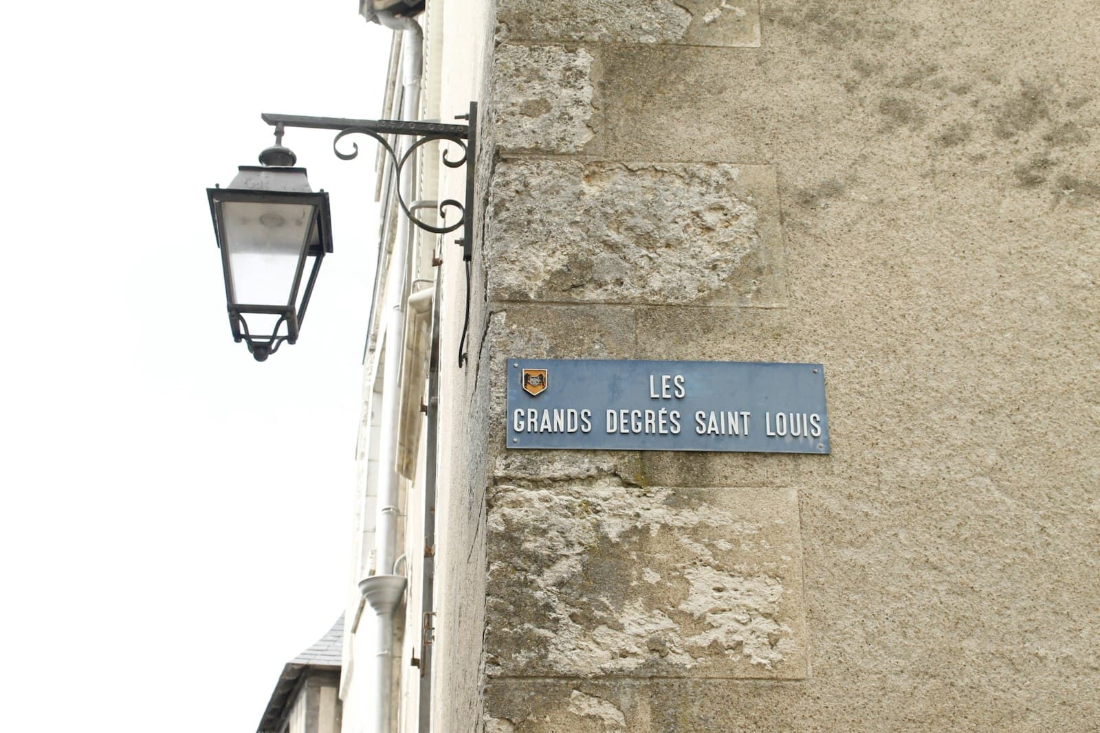 The Left Bank of the Writers — a street sign on the side of a building
