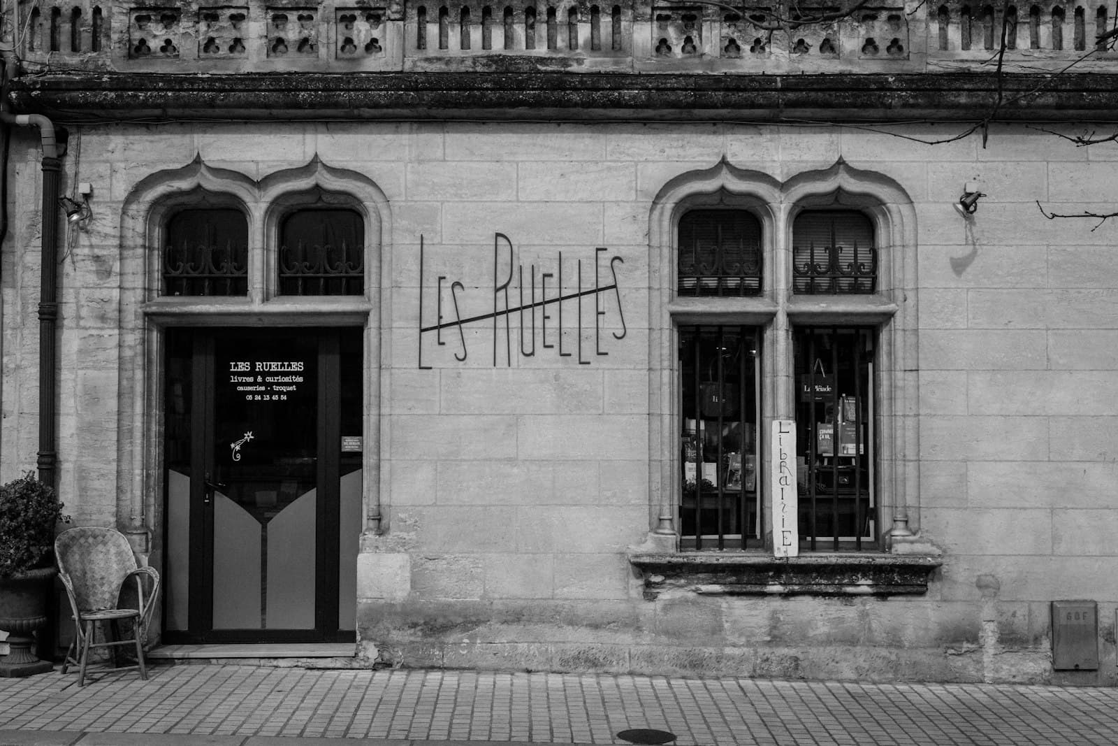 The Left Bank of the Writers — An old building with decorative windows and doors.