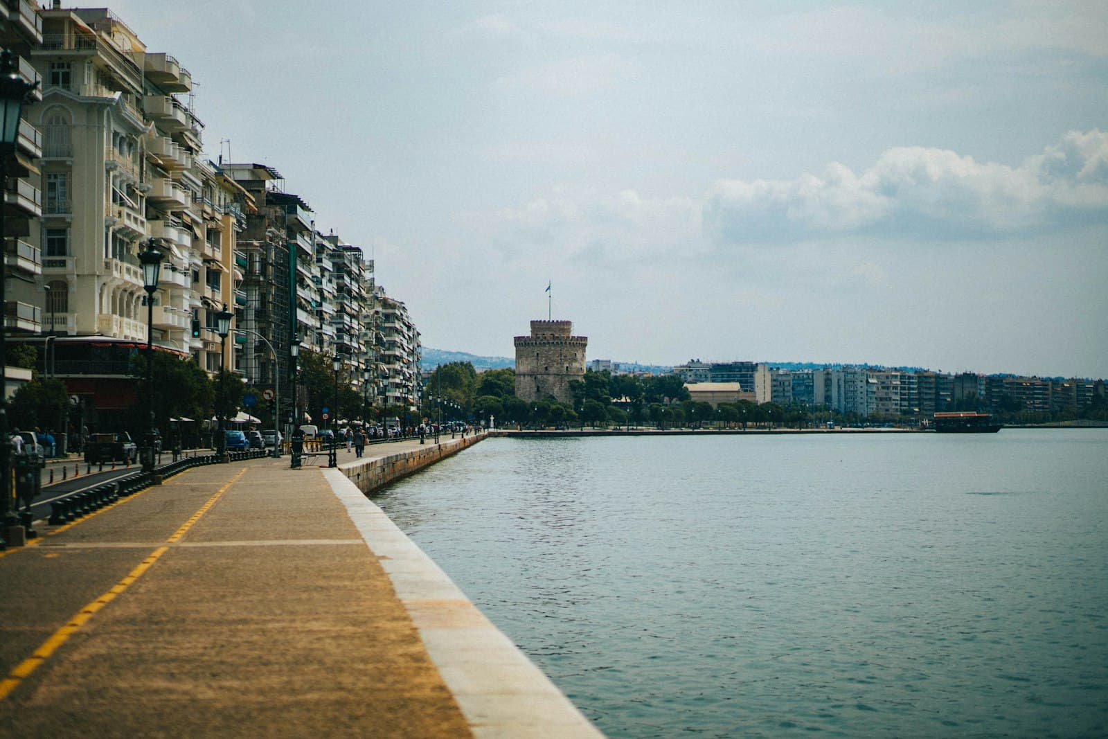 Thessalonique — a view of a body of water next to a row of buildings