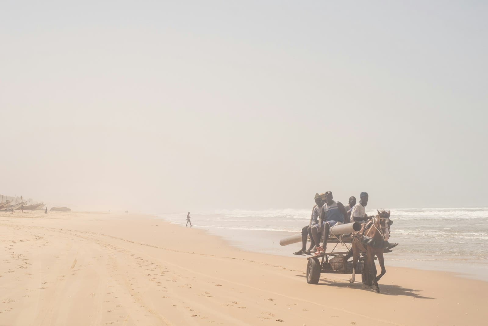 Thiès — a group of people riding on the back of a horse drawn carriage