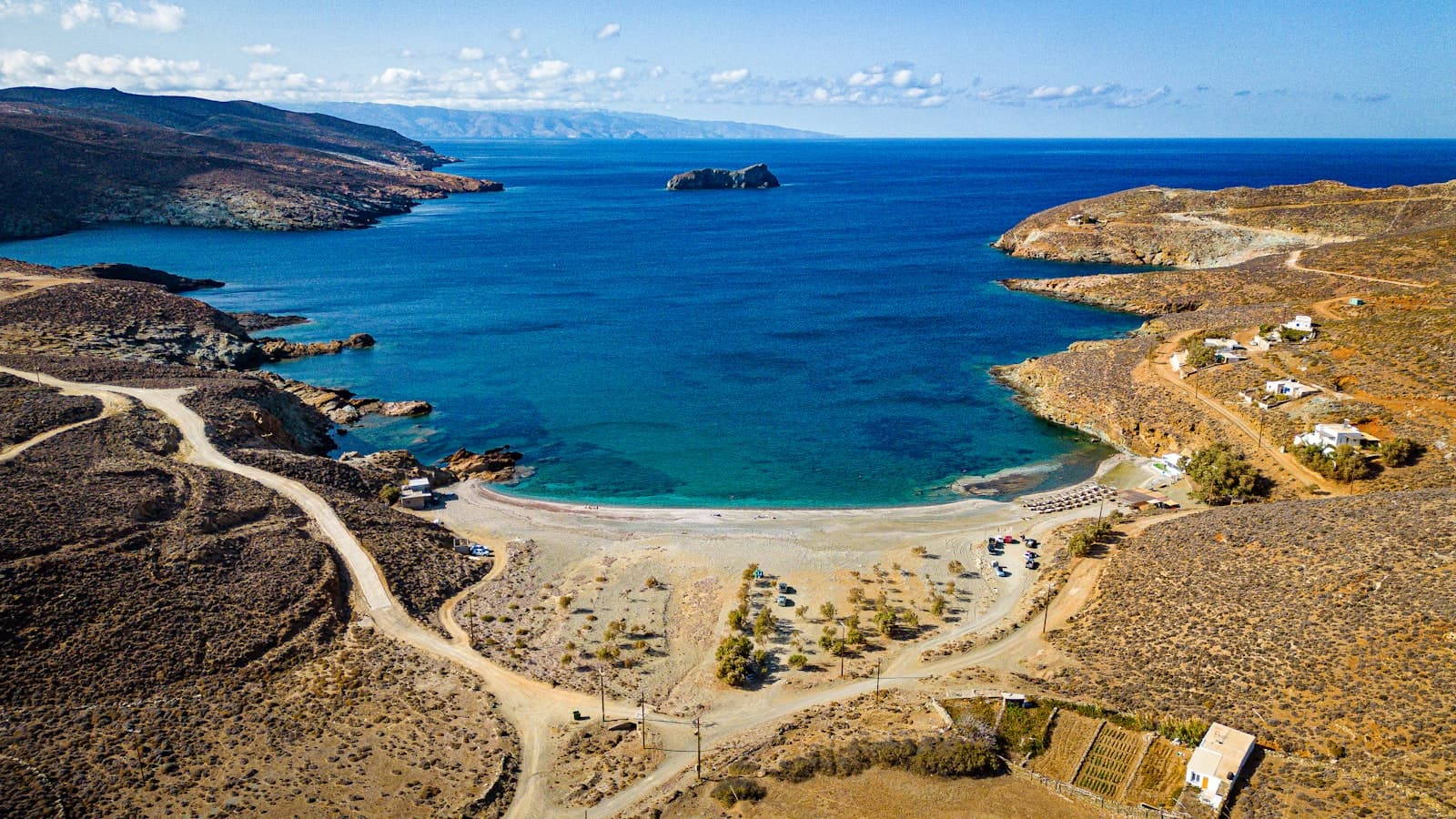Tinos — An aerial view of a beach and a body of water