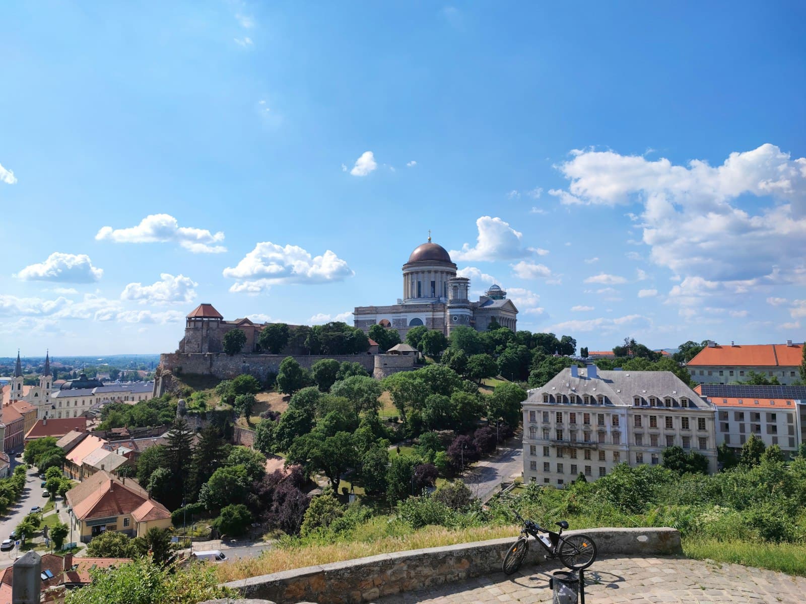 Tokaj — a bike is parked on a ledge overlooking a city