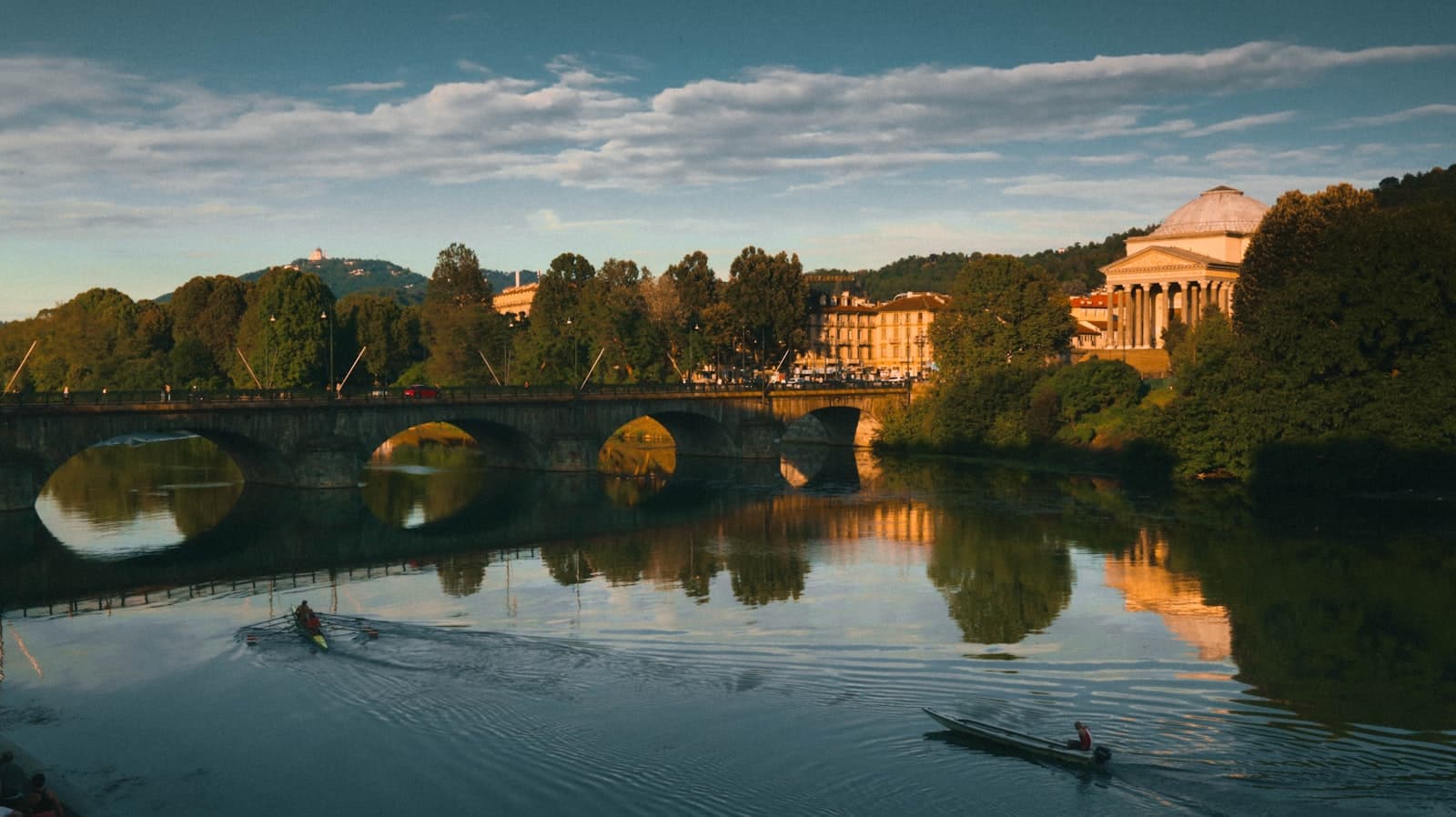 Torino — a couple of boats floating on top of a river