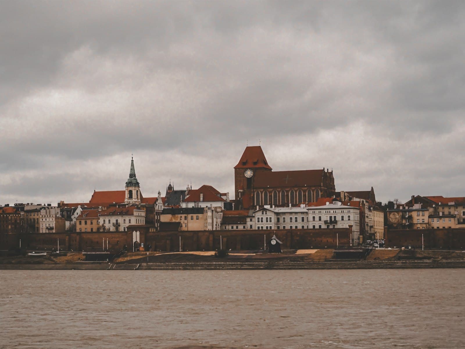 Toruń — a large body of water with a city in the background