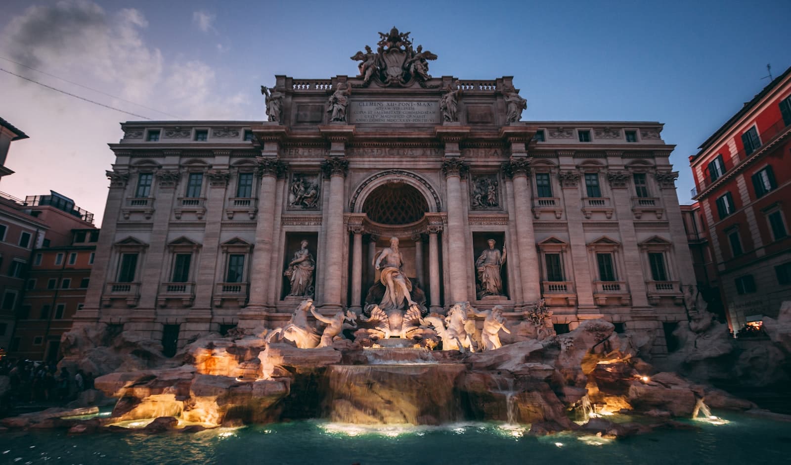 Trevi — A large building with a fountain in front of it