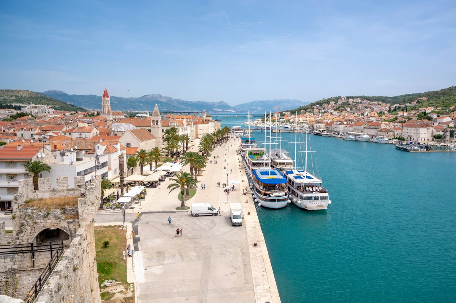 Trogir — a harbor filled with lots of boats next to a city