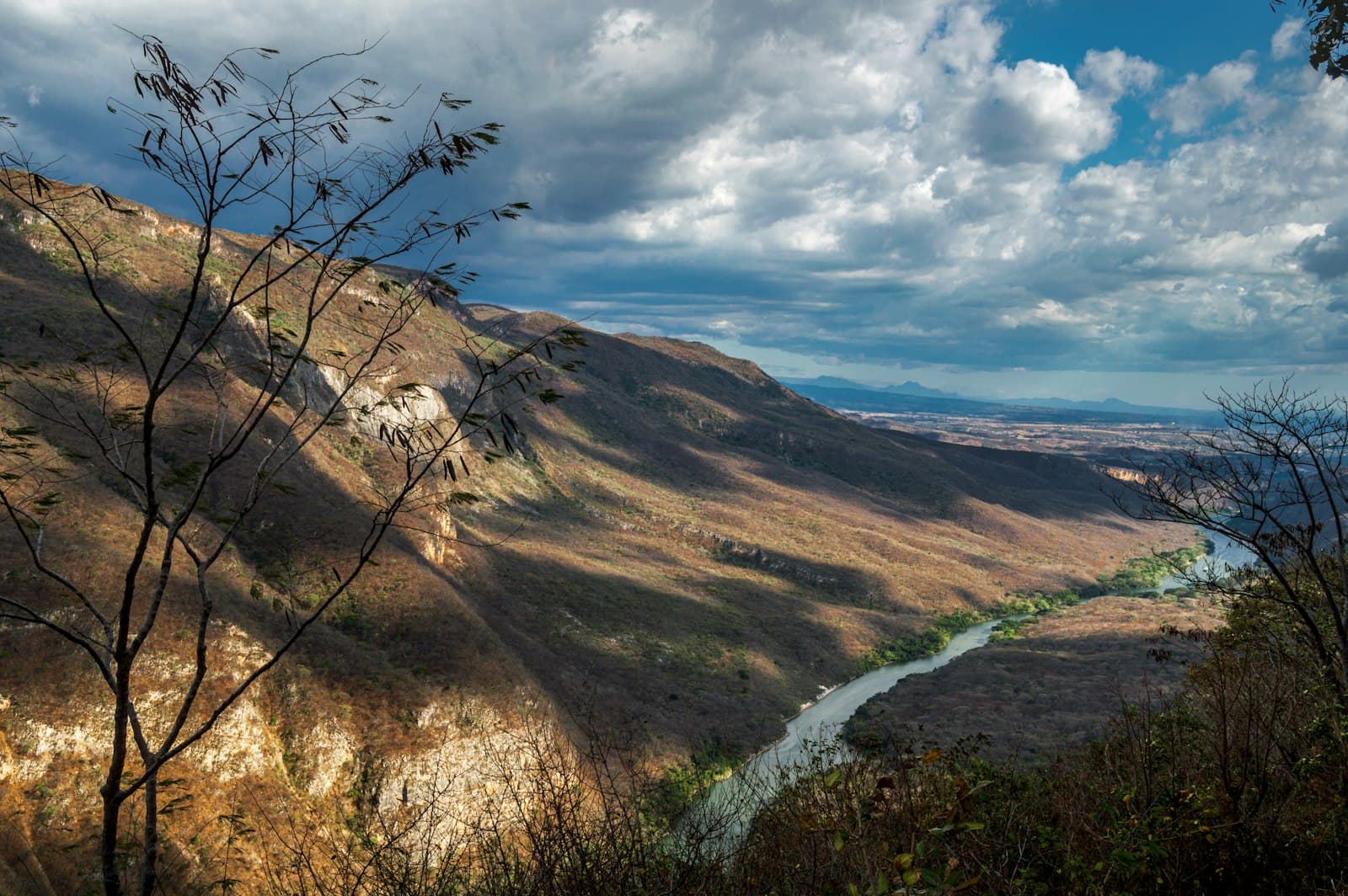 Tuxtla Gutiérrez — brown and green mountains under white clouds and blue sky during daytime