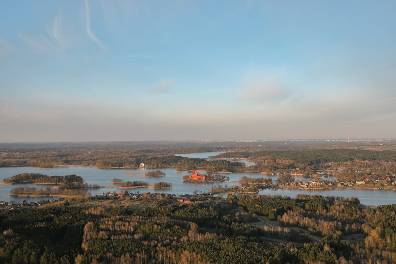 Tytuvėnai — body of water near mountain at daytime