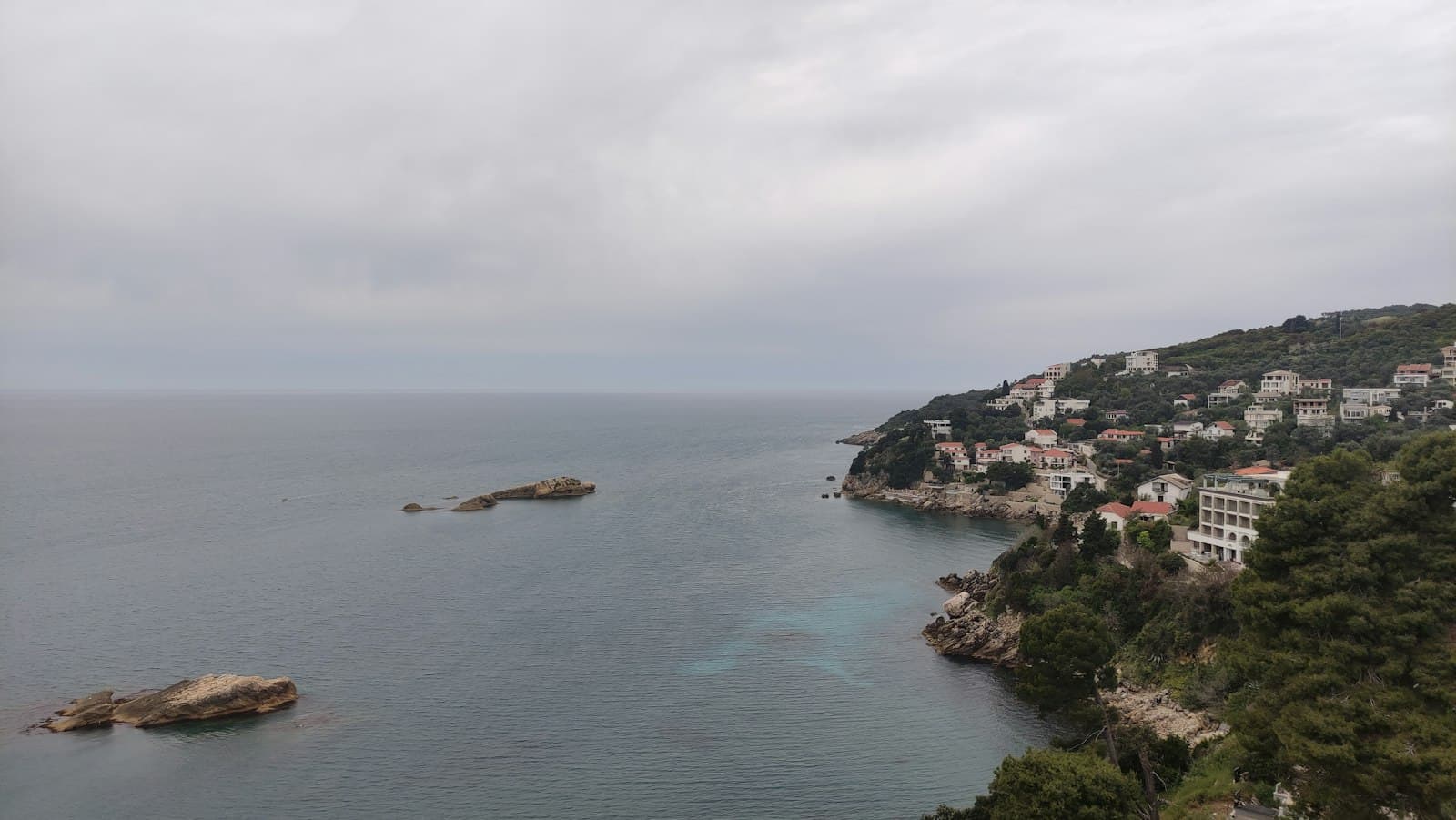 Ulcinj — a body of water surrounded by trees and buildings