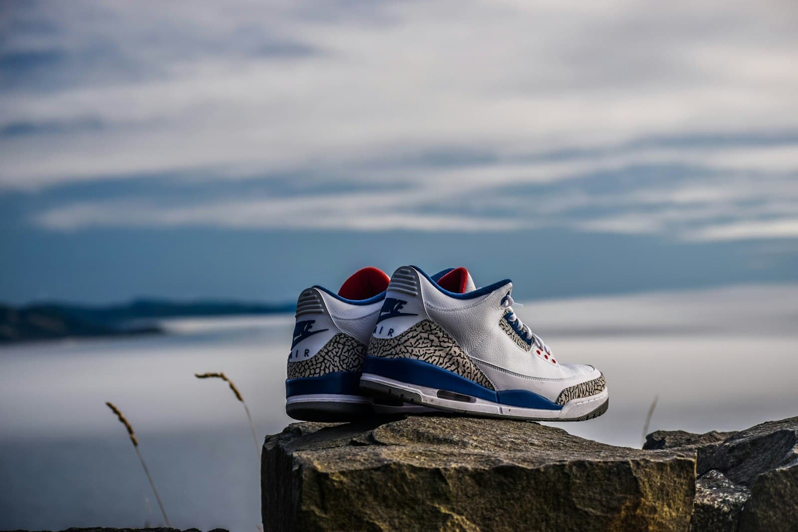 Umm Qais — pair of white-and-blue Air Jordan 2's on rock fragment