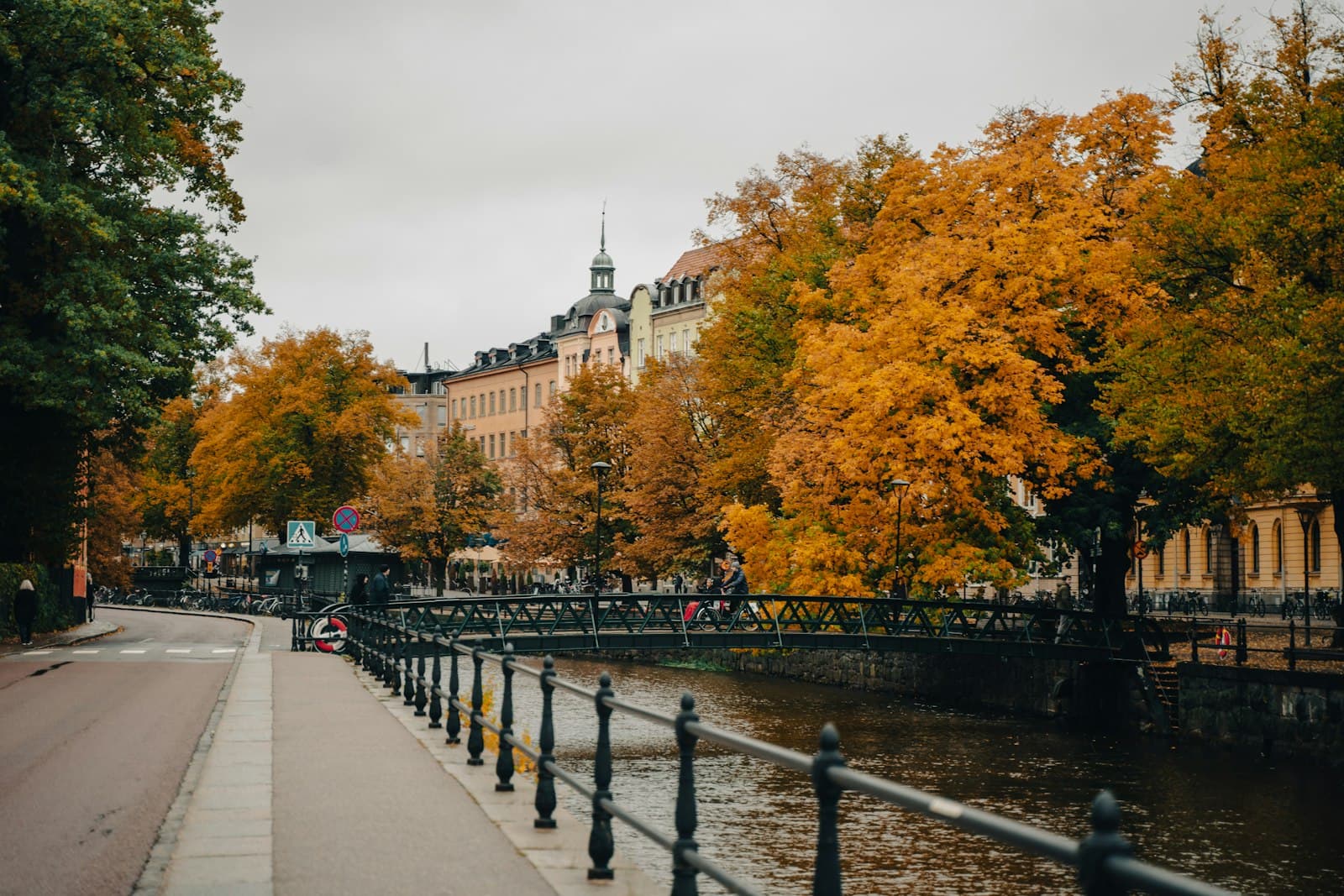 Uppsala — a river running through a city next to tall buildings