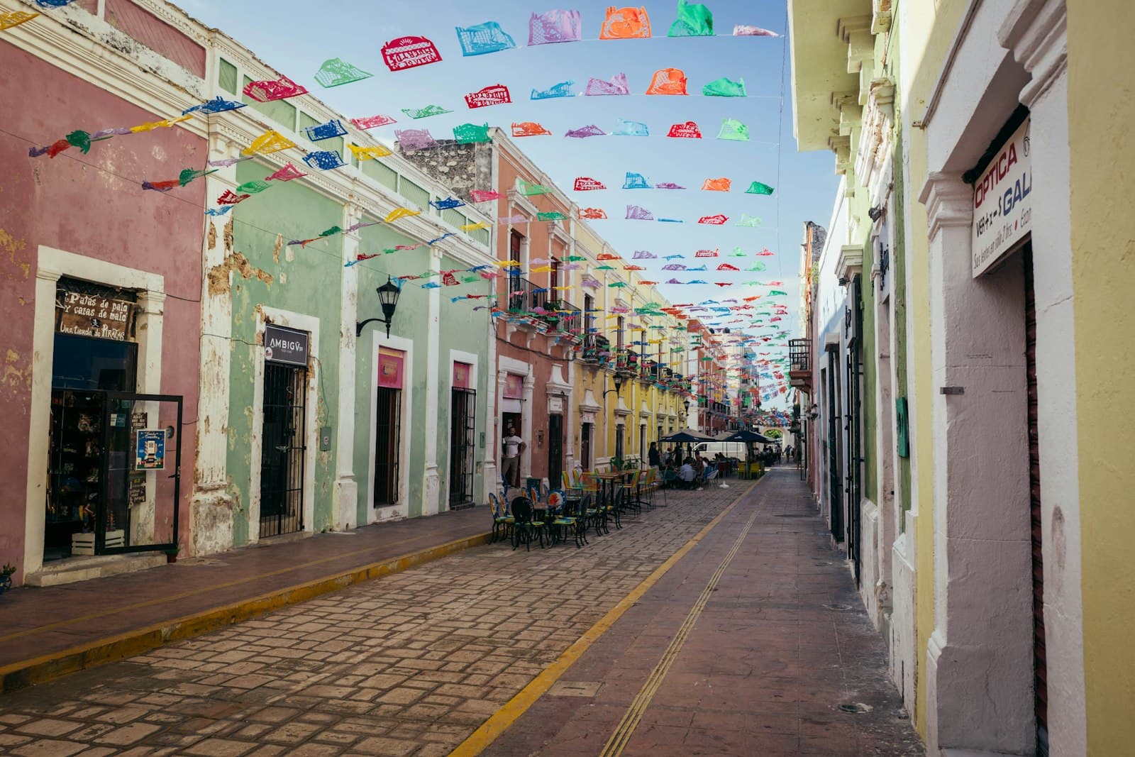 Valladolid — a street lined with colorful buildings and flags