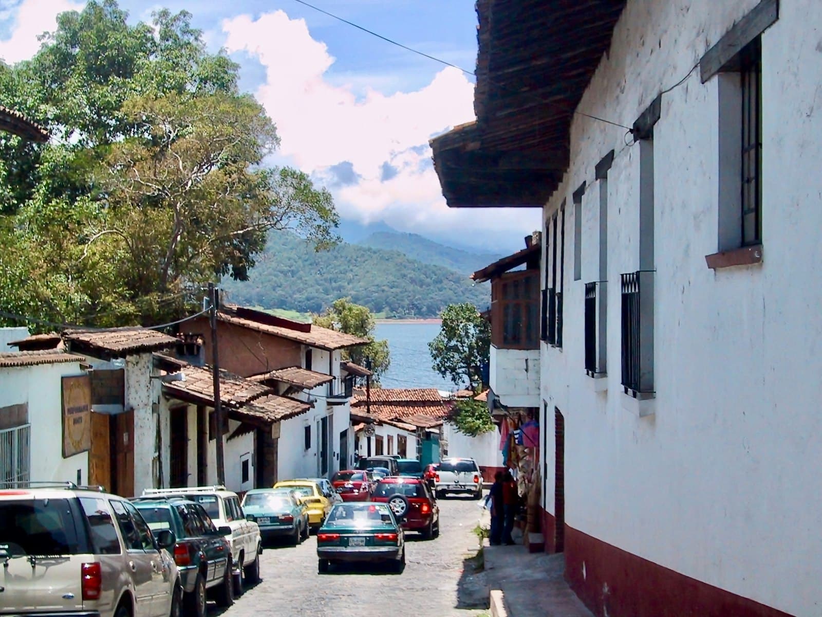 Valle de Bravo — a street with cars parked on both sides of it