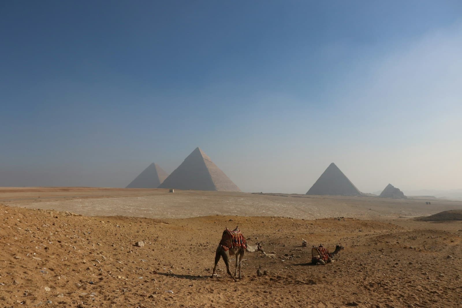 Valley of the Kings — people walking on brown sand near pyramid during daytime