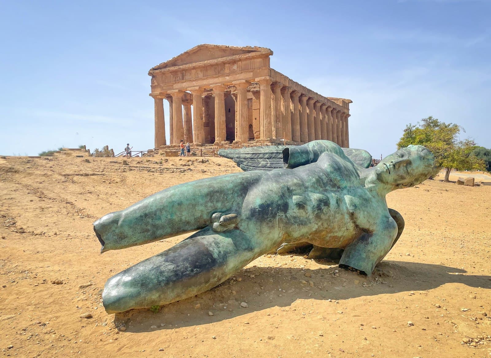 Valley of the Temples — a statue of a bear laying in front of a building