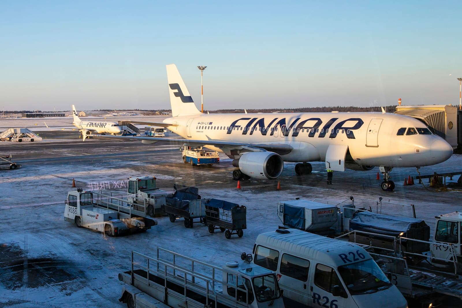 Vantaa — white and red passenger plane on airport during daytime