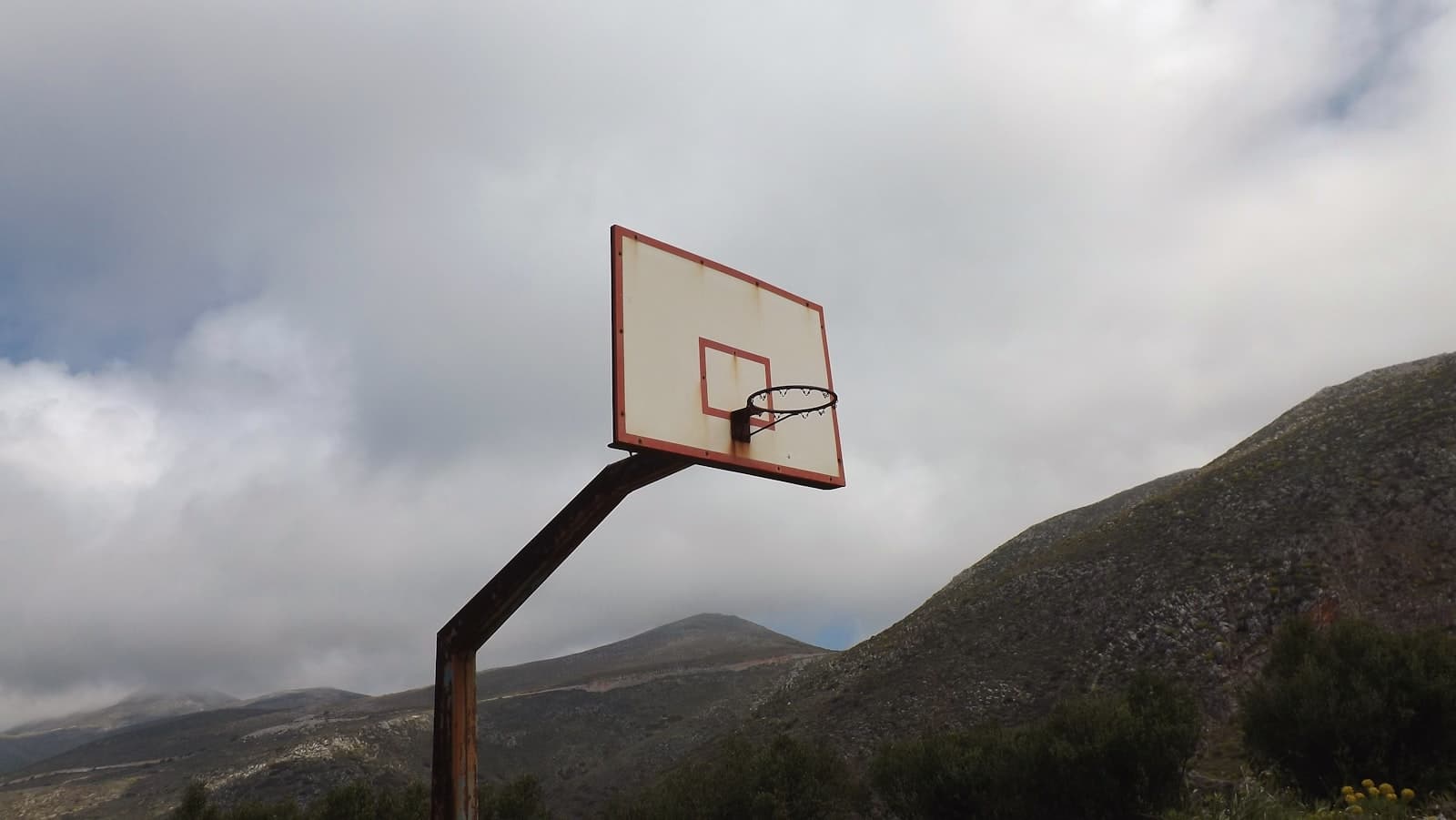 Vathia — white and orange basketball hoop close-up photography