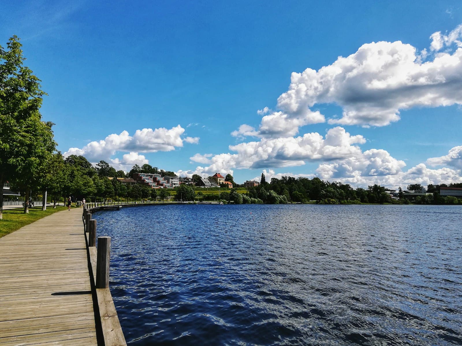 Växjö — brown wooden dock on body of water during daytime