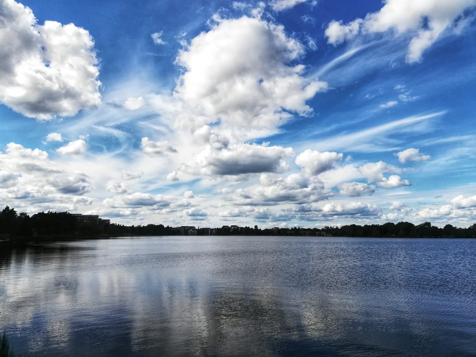 Växjö — body of water under blue sky and white clouds during daytime