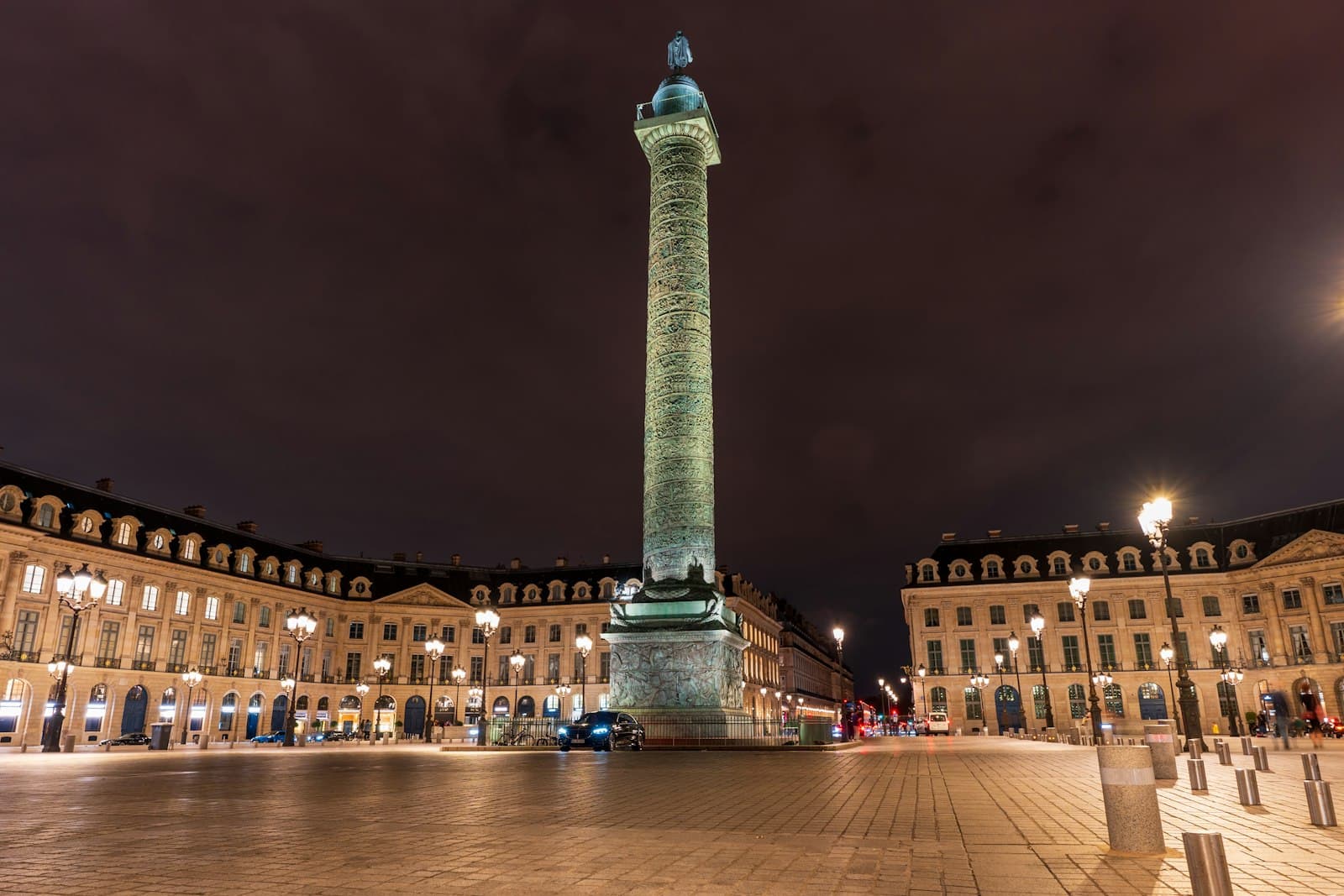 Vendôme — a very tall building with a clock tower in the middle of it