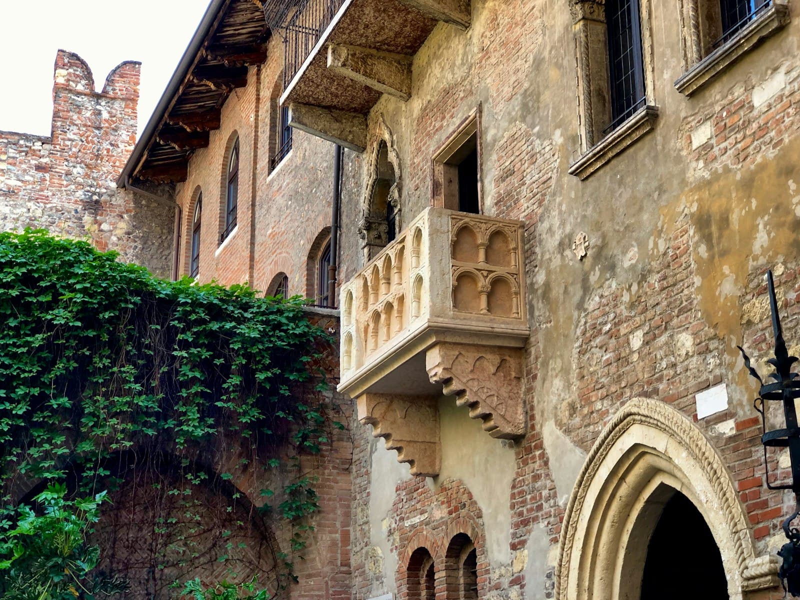 Verona — brown concrete building with green plants